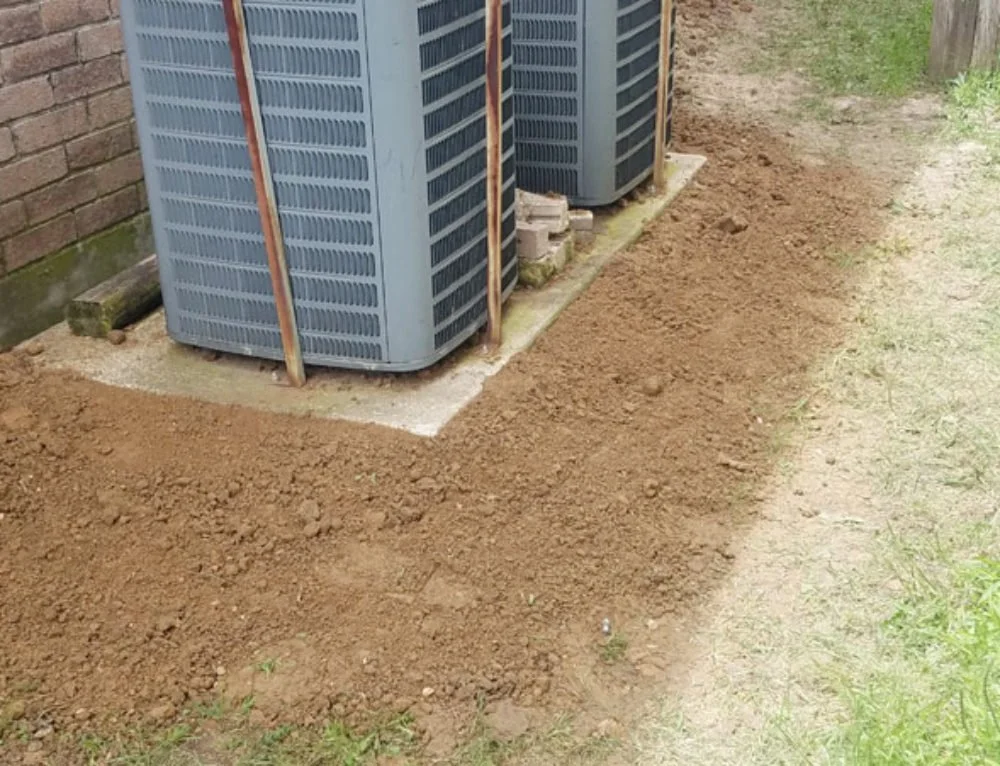 Fill dirt and gravel layered for foundation stability and drainage in construction site