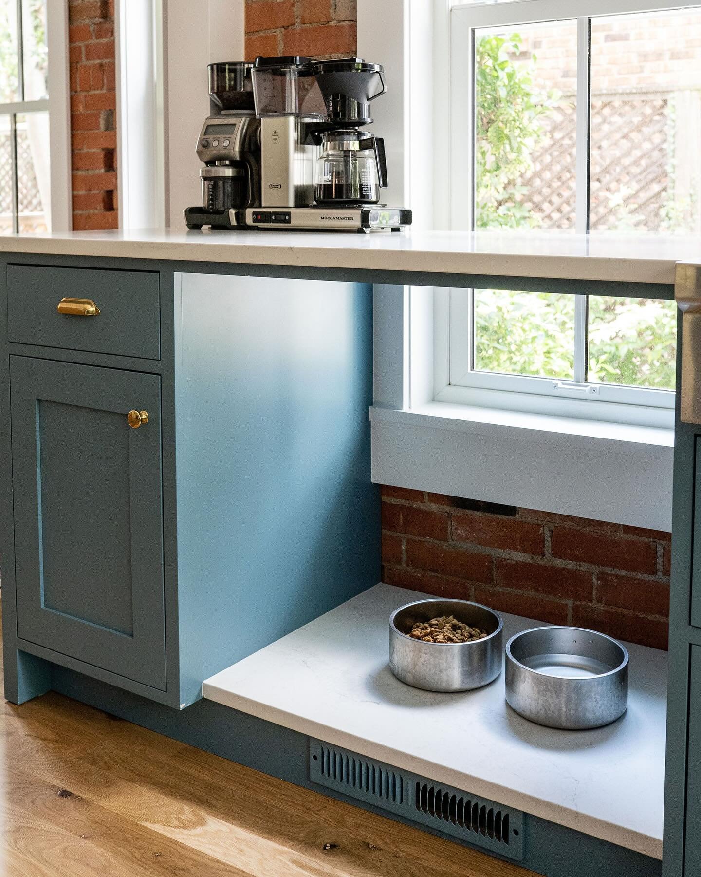 Designing with dogs in mind! We had a low window in the kitchen and wanted to span the countertop across to have more prep space. We decided this was the perfect spot to put in a countertop for the client&rsquo;s sweet pup to have her meals!
&bull;
P