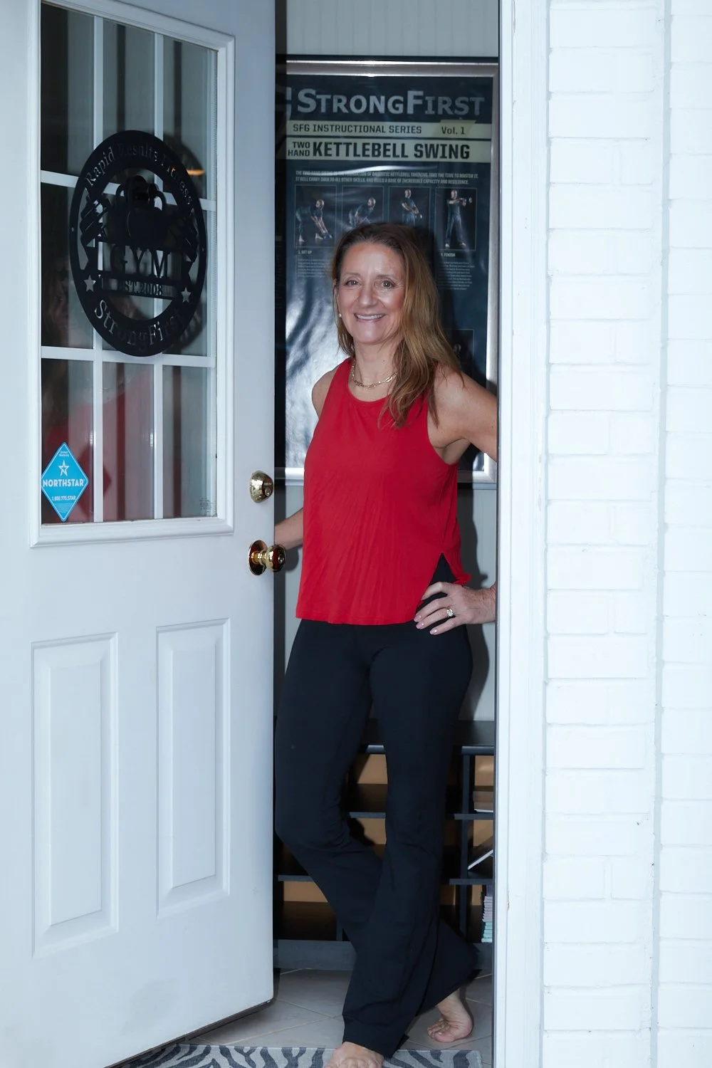 RRF-W-002-social Betsy-at-door-red-top (web).jpg