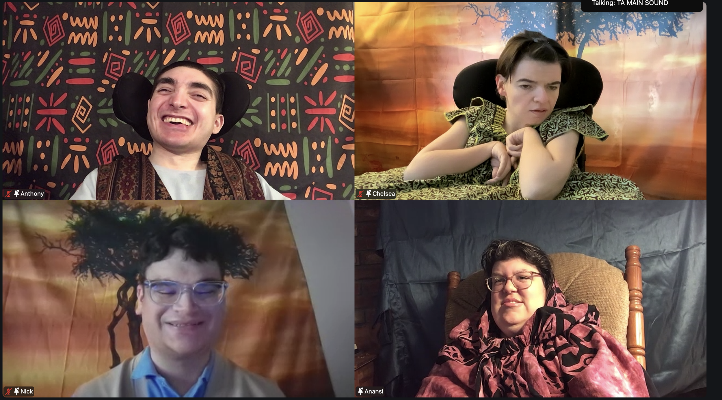 Four Zoom windows in a grid each feature an online actor in costumes with African inspired prints in front of a scenic backdrop. 2 actors are in wheelchairs.
