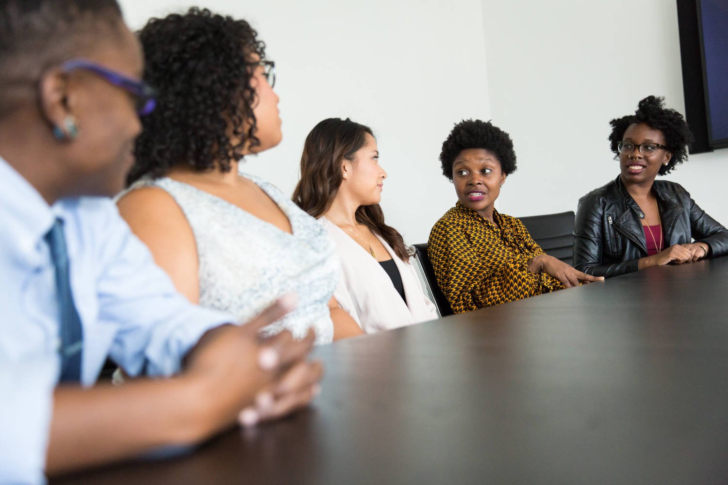 A group of women speaking to each other