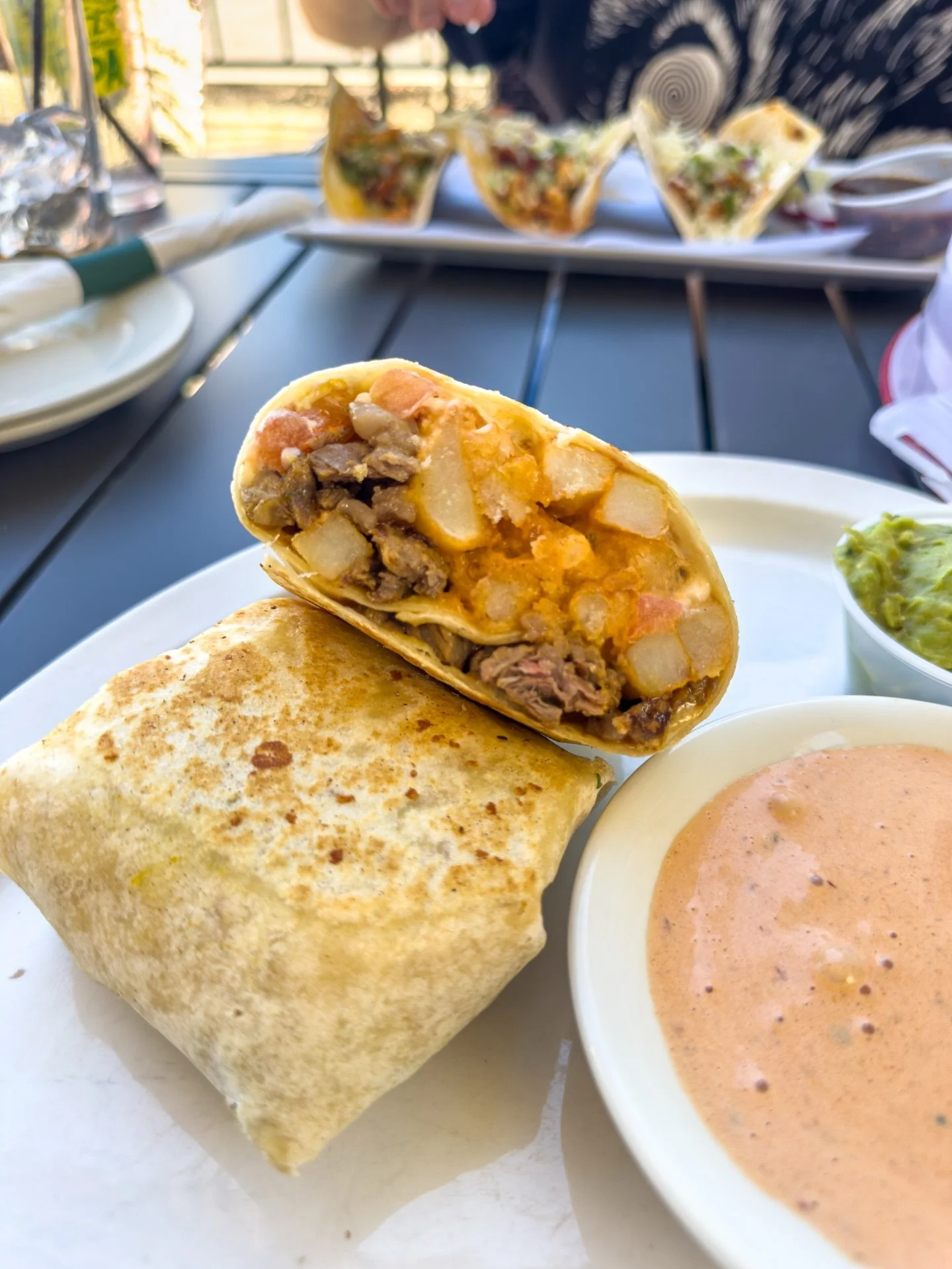 Manifesting the warm weather with this California Burrito and a Poloma at @lafiesta_mexican 🌯😋