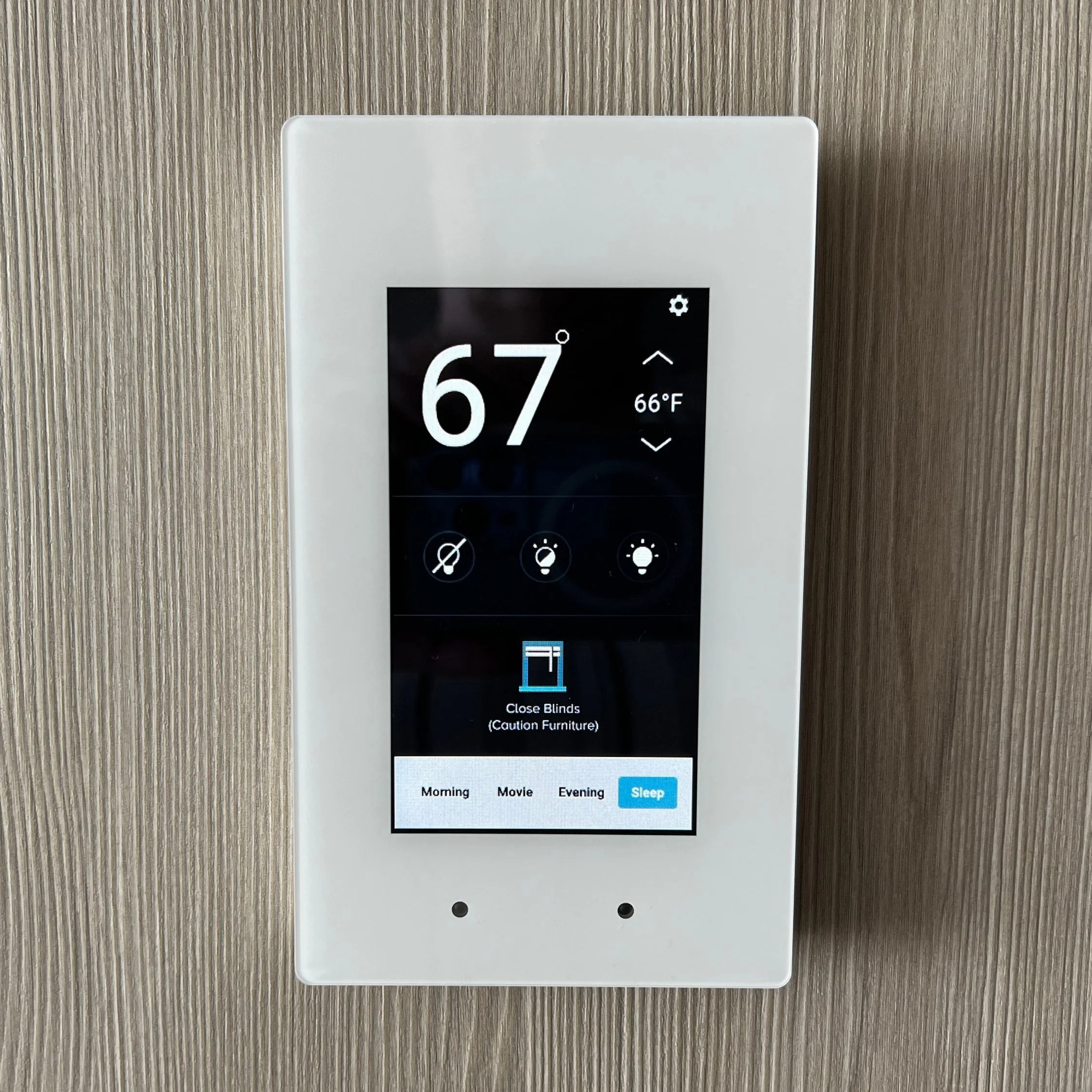 A wall-mounted control panel that displays the cabin's temperature, status of the lighting and status of the drapes. It allows you to control the above with the touch of a finger.
