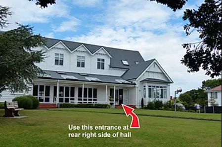 Park around the back, then use the side entrance at the rear of the hall.