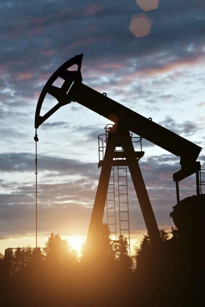 Oil pumpjack at sunset