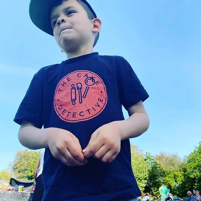 This is Cooper my four year old. He is showing off his new The Cake Detective tee. I personally brought these to see what they were like for a possible fundraiser. So if you see someone wearing one it will be one of the family. Come say hi. Hope everyone is enjoying the sunshine. We are soaking in some sun at the first gourmet in the gardens of the season.