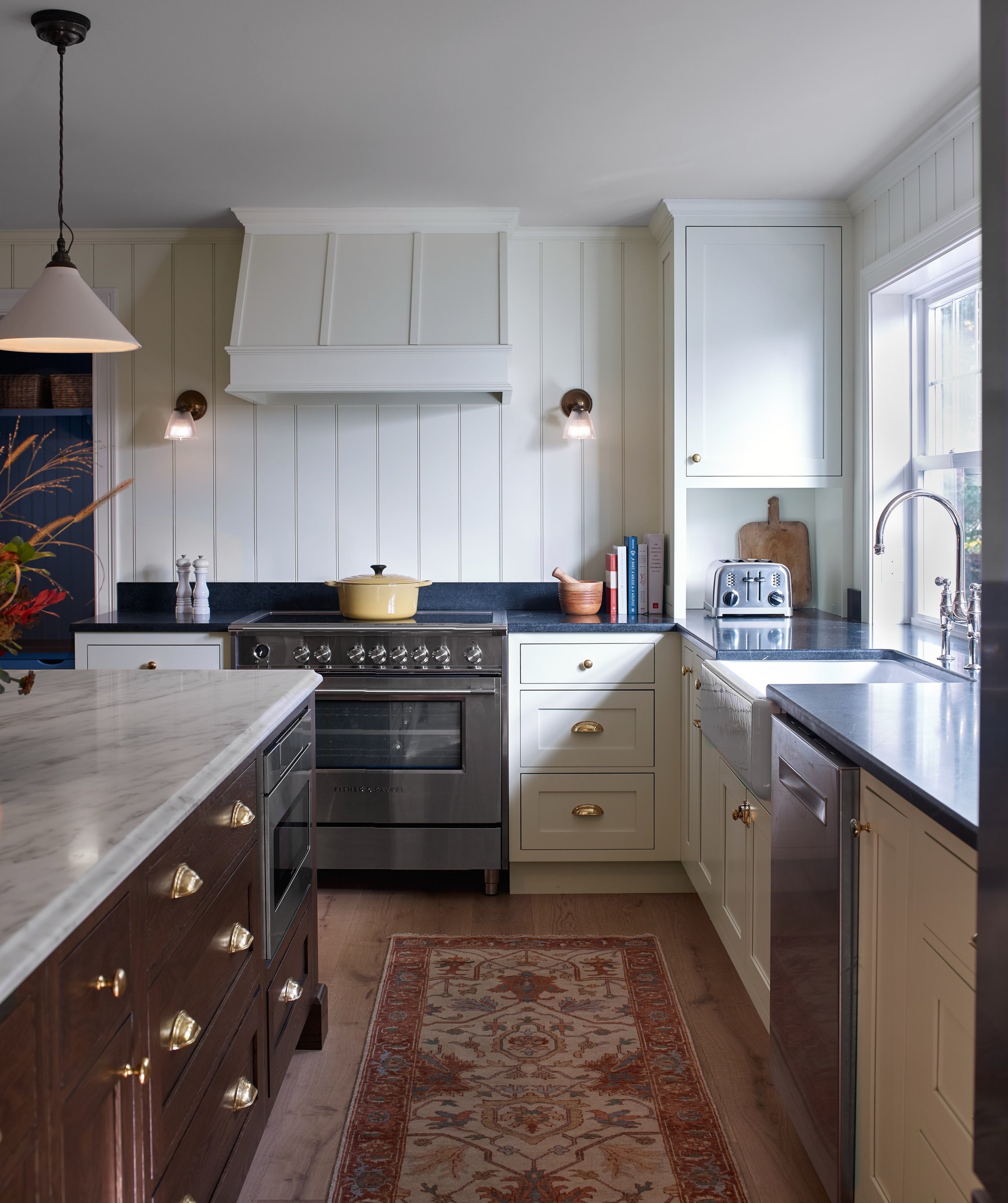 It&rsquo;s often the quieter details that make a space feel special - the beadboard walls, thoughtfully designed cabinetry, unlacquered brass hardware, the contrast of warm wood and natural stone. Classic, considered and designed to age beautifully. 