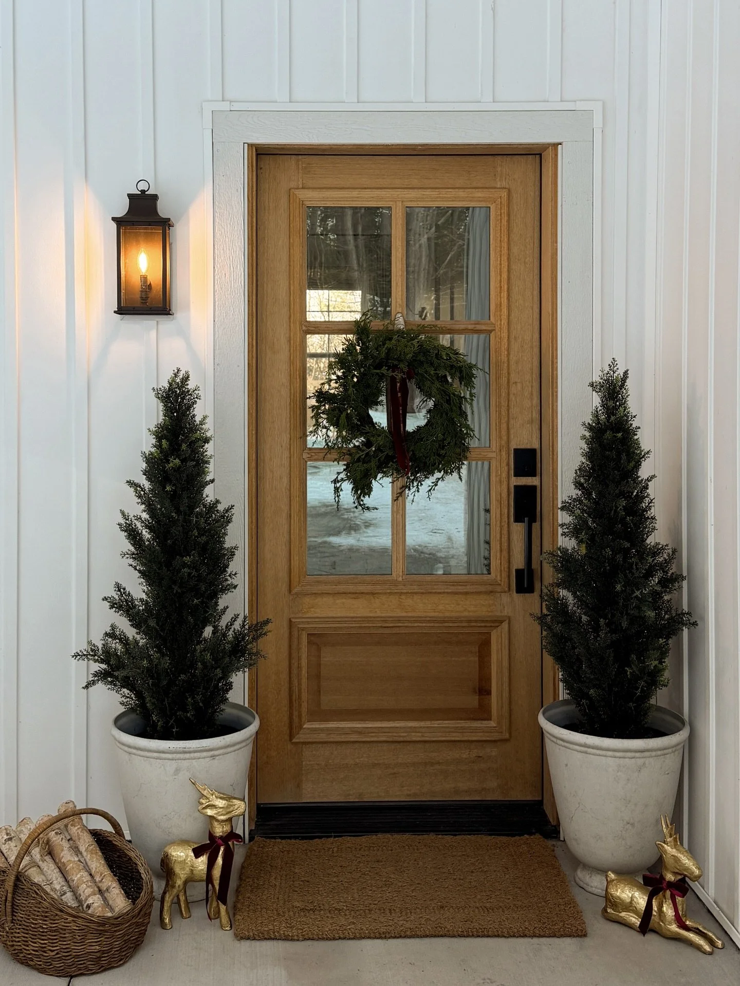 A simple Christmas front porch 🌲❤️ I used mostly what I had on hand plus a thrifted basket &amp; these little golden reindeer! I haven&rsquo;t decided if I&rsquo;m going to paint them yet!! What do you think?! 

Comment SHOP for links! Some things a