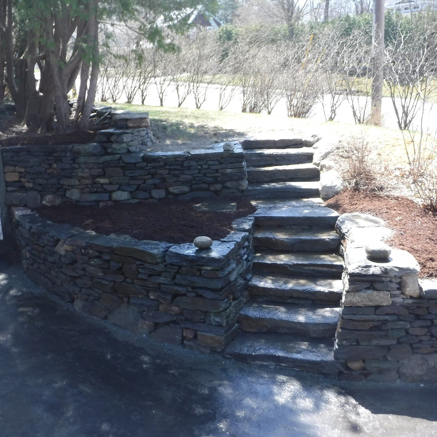 First one is in the books! A fun fieldstone retaining wall/staircase combo with a couple different tiers.

Naturally I forgot to take a 'Before' shot but you should have seen the condition this was in when we showed up! A major improvement!

#dryston