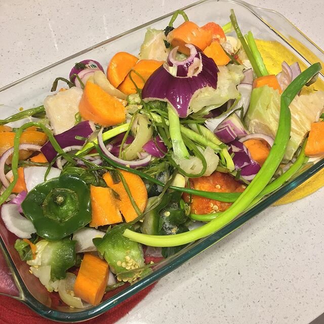 been keeping a big bag of my veggie scraps in the freezer so I can make my own veggie broth. carrots, green &amp; red peppers, red &amp; white &amp; green onions, cabbage, garlic, etc. about to roast this stuff and sim simma it down before straining 