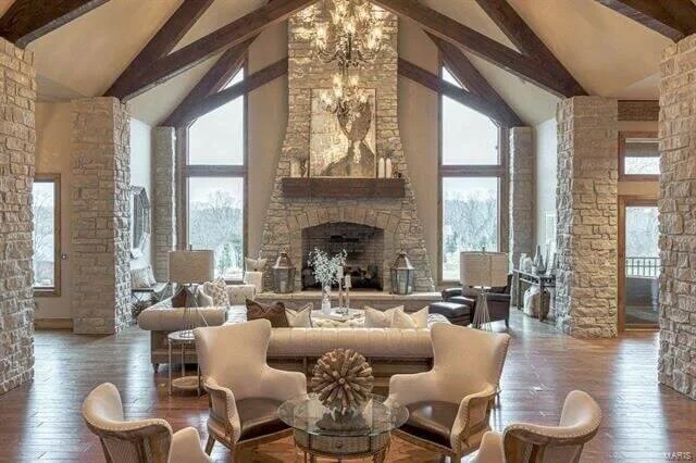 Grand Room with Exposed Wood Beams and Fireplace.jpeg