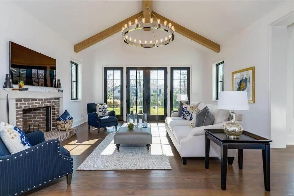 Living room with Blue Accents and Exposed Wood Beams.jpeg
