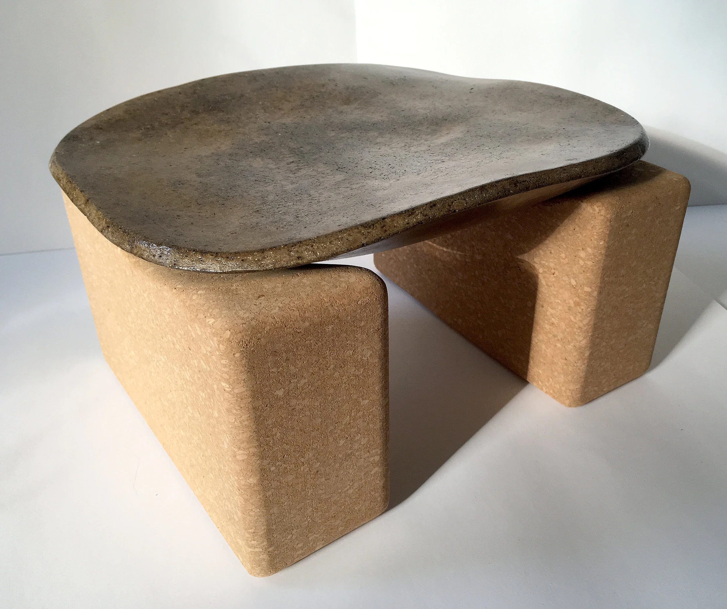 Unfired earth, linseed oil, shellac, carved cork