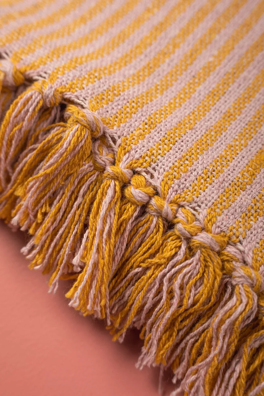 pink mustard throw tassels.webp