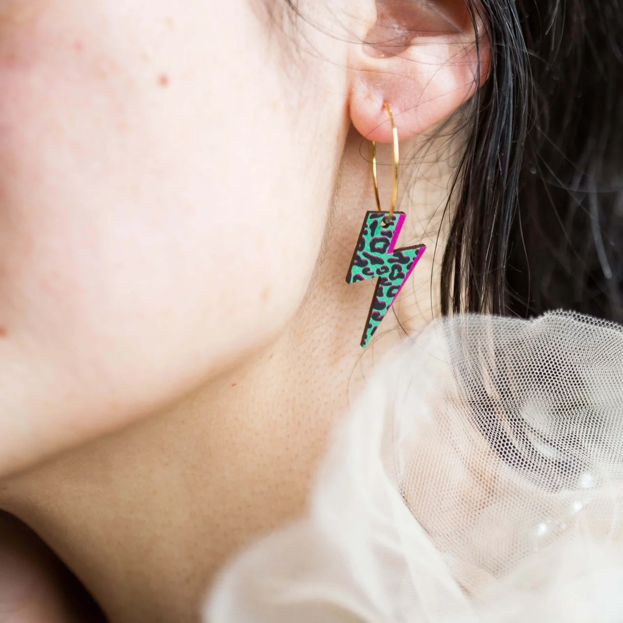 green pink animal earrings.webp