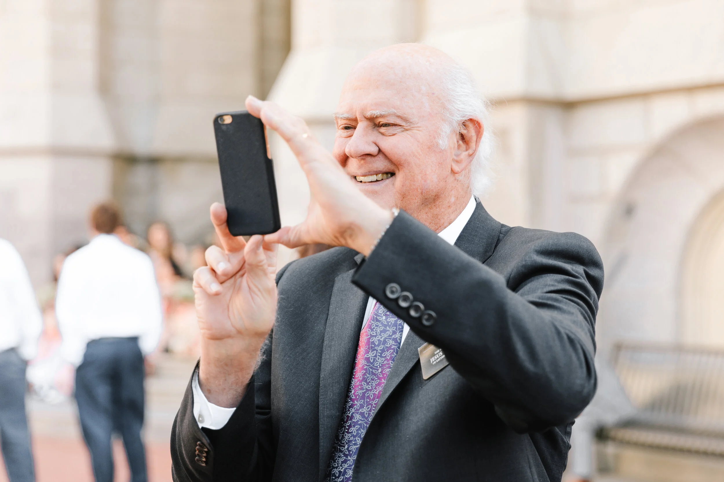  happy grandpa taking a picture wedding guest photo shoot professional photographer clarity lane photographer wedding guest attire inspiration grandfather of the bride or groom grandfather wedding attire inspiration wedding goals capturing all of the