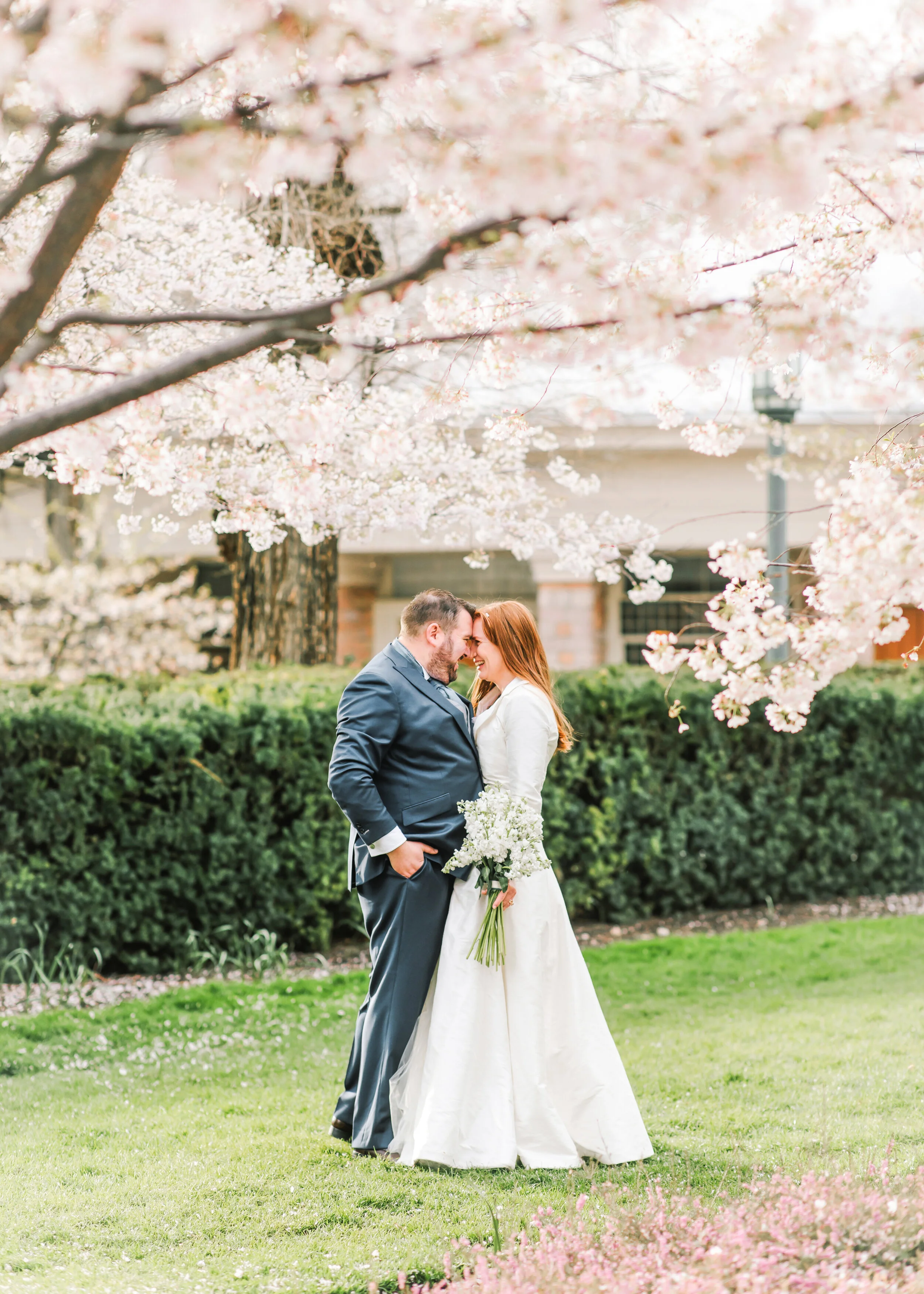  under the cherry tree blossoms outdoor wedding photo shoot inspiration wedding dress inspiration long sleeved wedding dress wedding pose inspiration man and wife husband and wife spring wedding  inspiration spring wedding goals wedding inspiration #