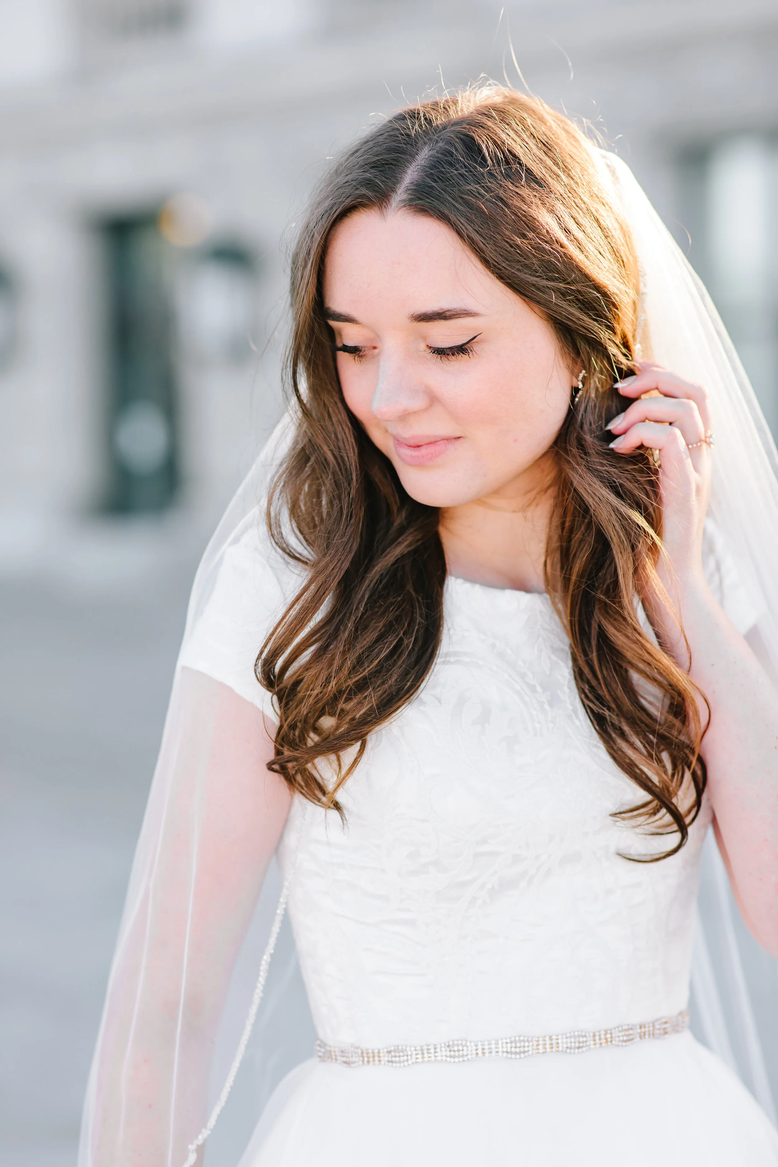  short sleeved elegant simple wedding dress inspiration simple elegant wedding hairstyle inspiration beaded belt wedding attire inspiration just the bride bridal pose inspiration gently pulling back her hair bridal photo shoot wedding inspiration goa
