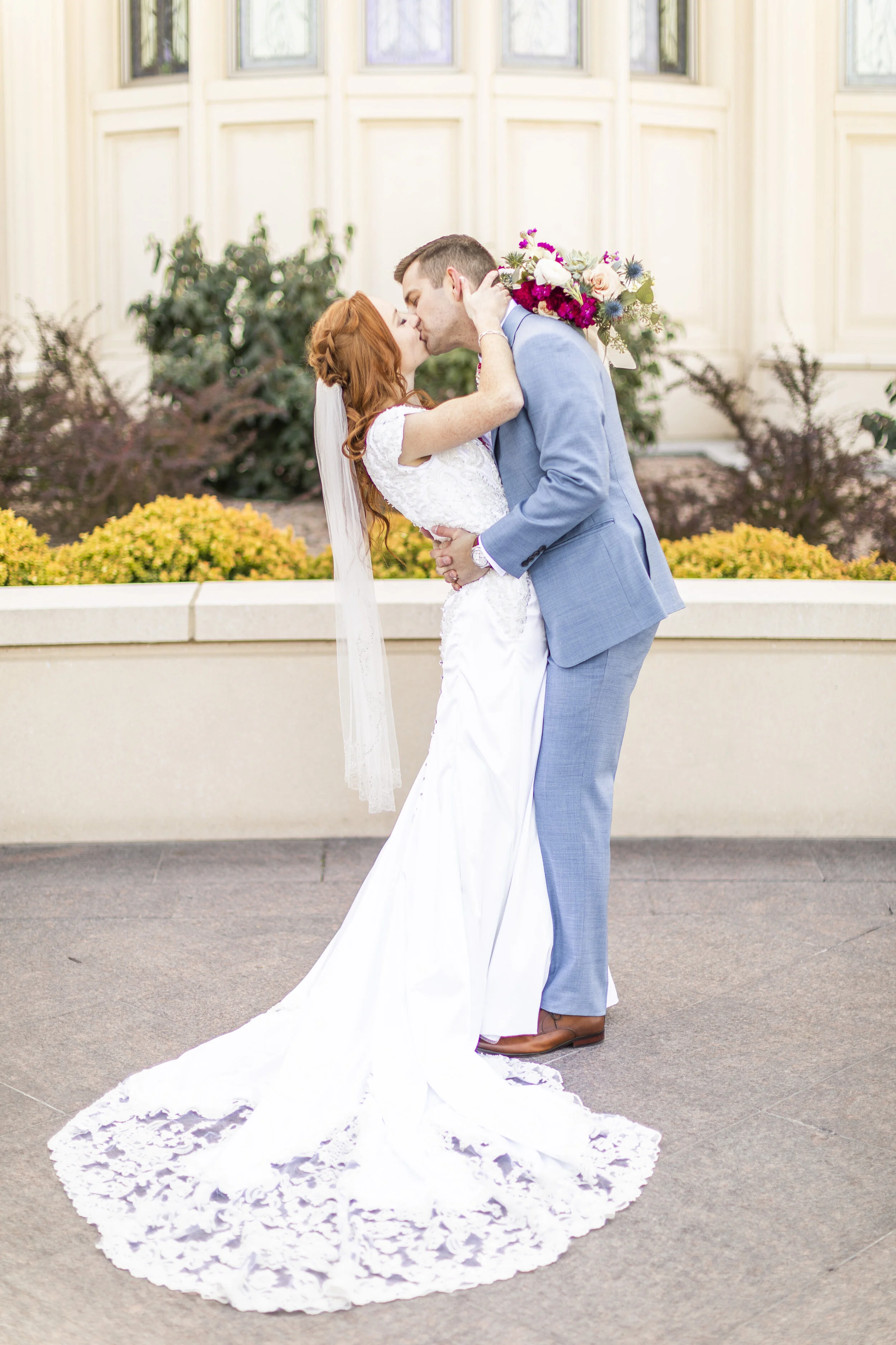  romantic wedding day pose inspiration beautiful train wedding outfit inspiration wedding attire goals blue suit wedding groom attire romantic kissing pose on the wedding day inspiration wedding day photo shoot inspiration wedding goals marriage goal