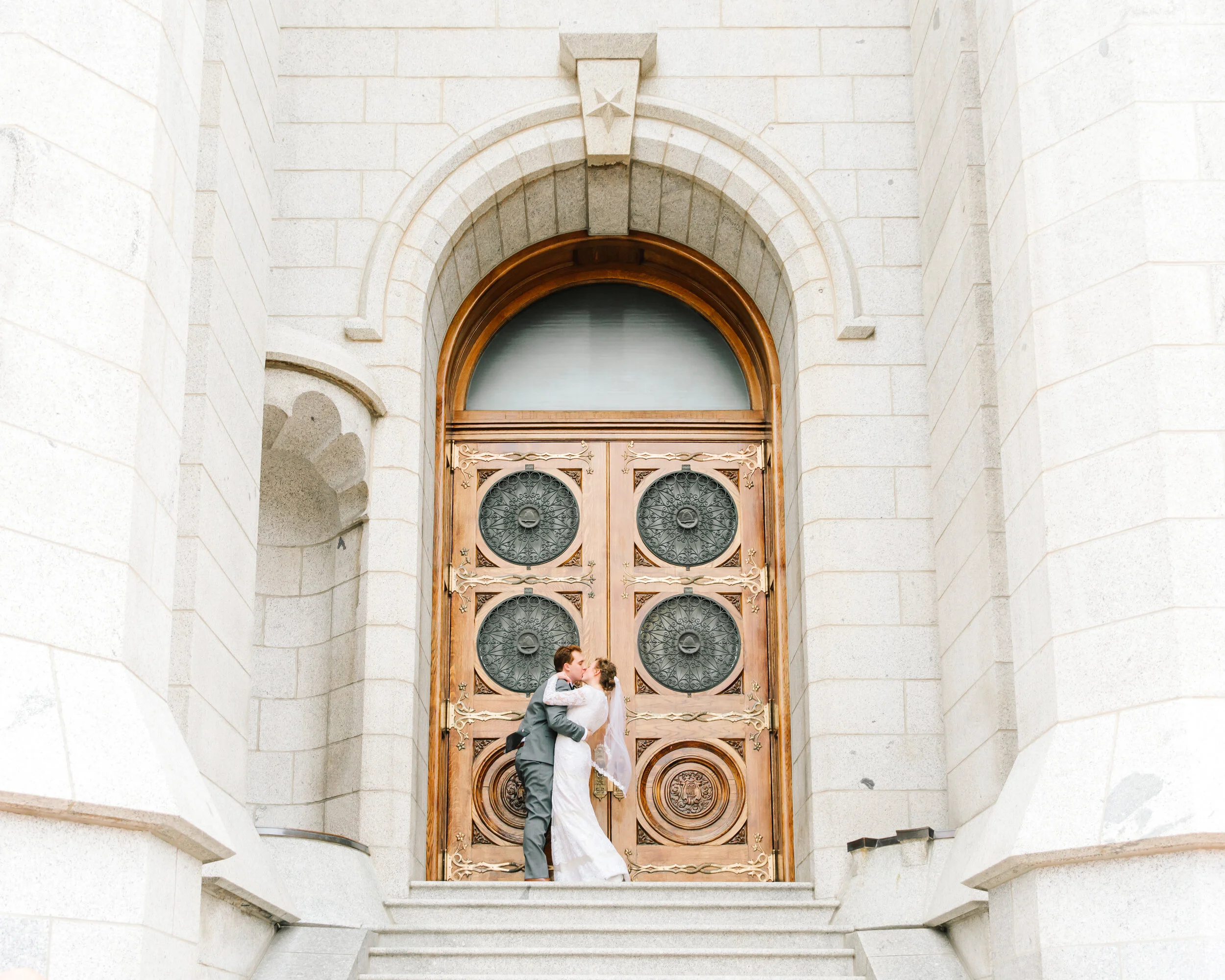  salt lake city temple photo shoot for time and all eternity beautiful wooden doors doors to eternity husband and wife formal wedding photo shoot professional utah photographer wedding style inspiration utah wedding goals lds wedding inspiration #wed