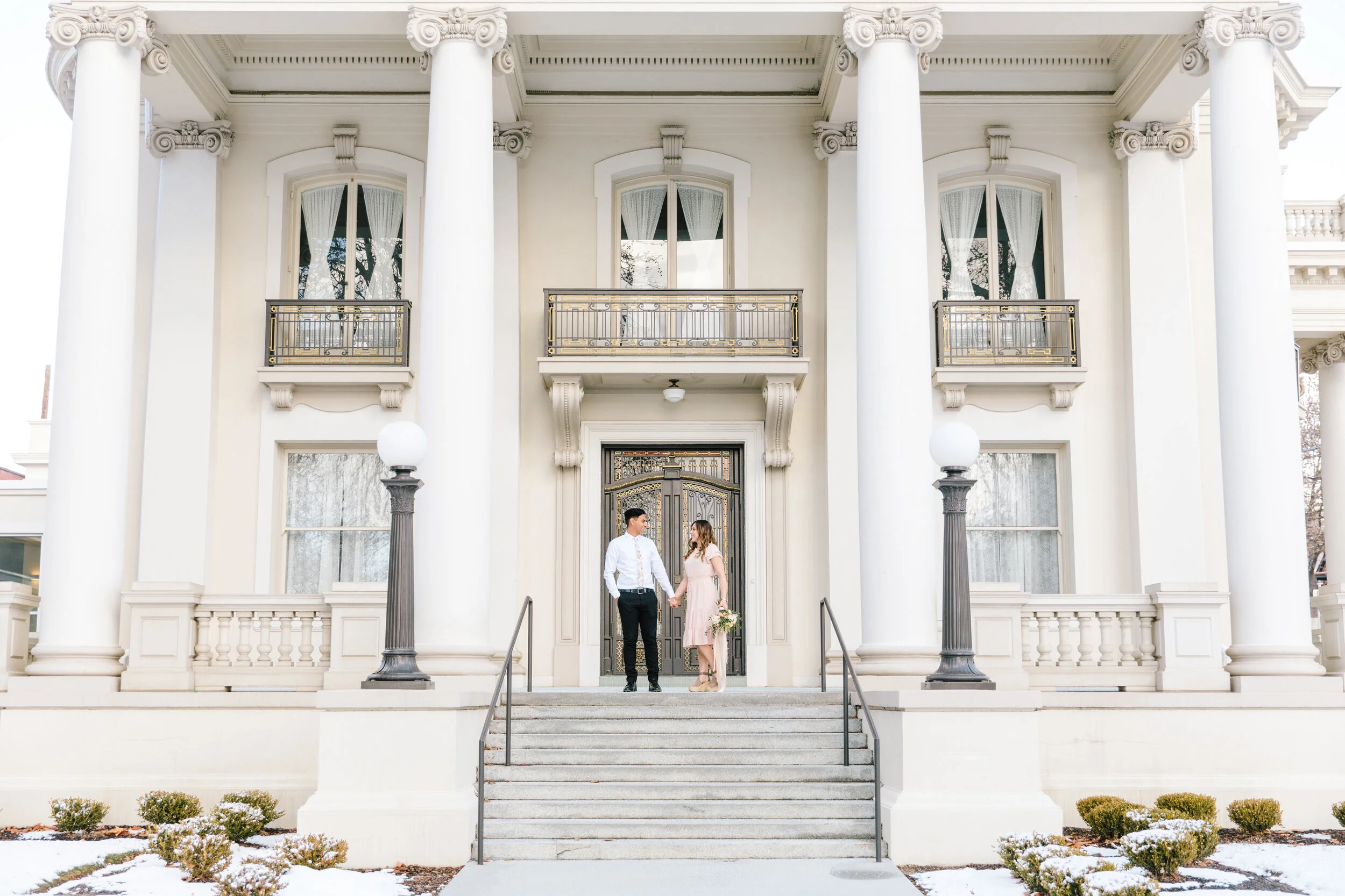  couple holding hands pose inspiration beautiful capital building utah photo shoot inspiration locations modest outfit inspiration winter engagement session bright white and airy photo shoot session engagement session aesthetic professional photograp