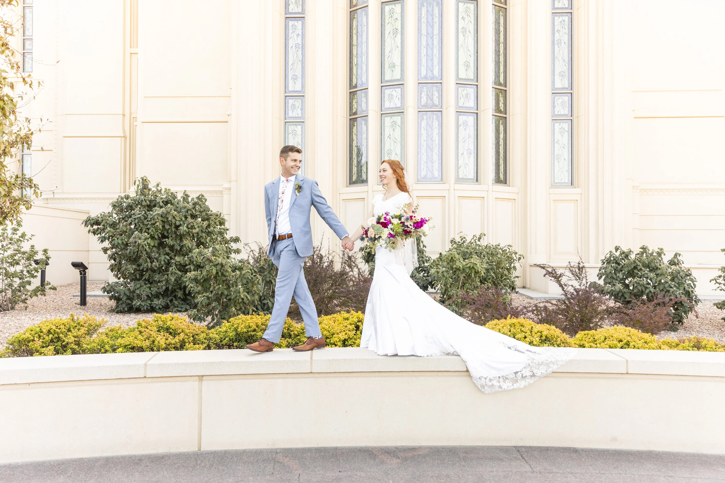  unique walking on the temple walls pose inspiration unique temple wedding outside the temple pictures not your everyday temple wedding wedding day pose inspiration wedding day photo shoot inspiration wedding day photo shoot goals walking together fo