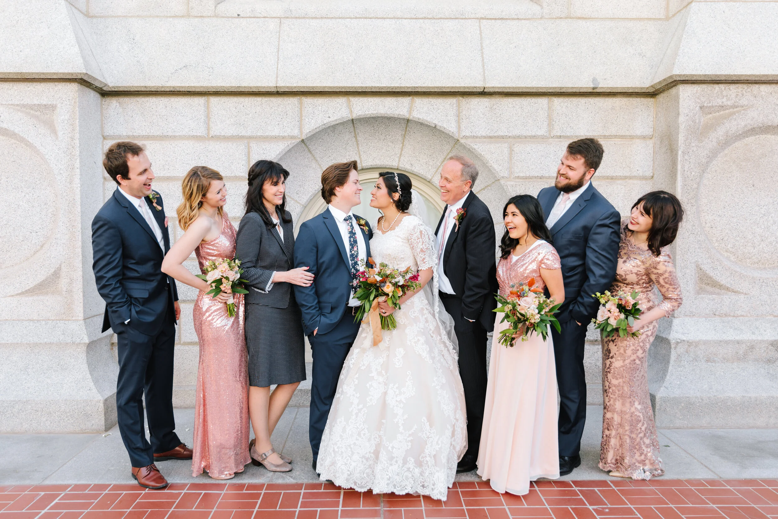  looking at the bride and groom family pose inspiration on wedding day wedding day photography professional utah photographer professional clarity lane photographer lds wedding photo shoot wedding day photo shoot inspiration  wedding attire inspirati