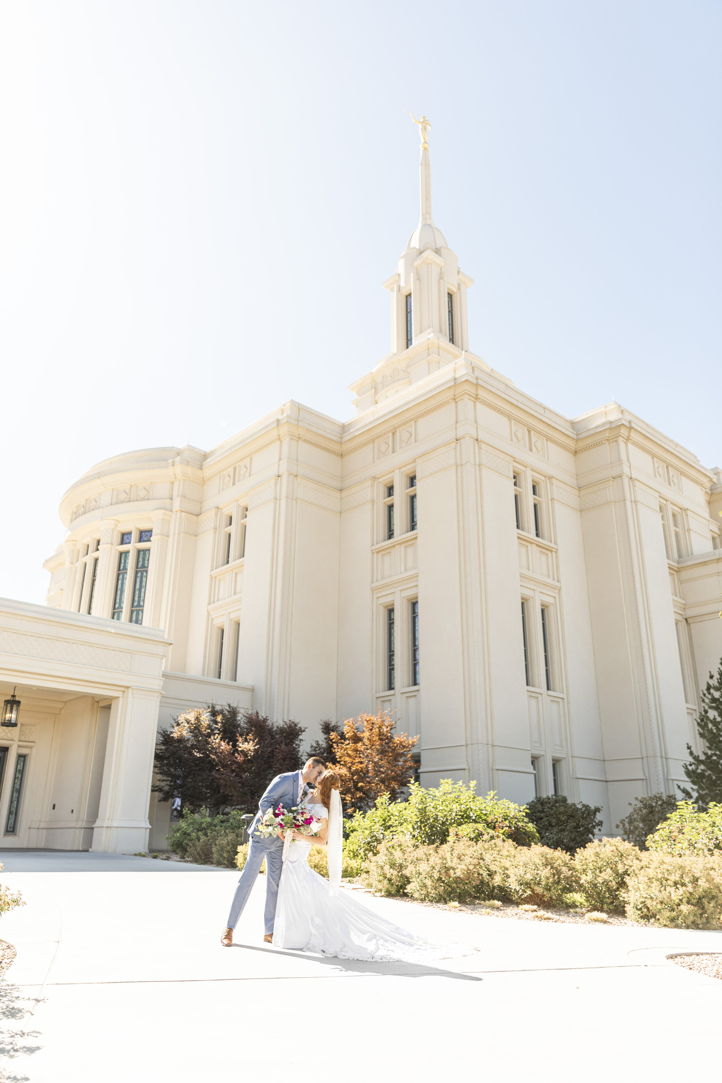  beautiful temple beautiful couple beautiful summer day all dressed in white sealed for time and all eternity together forever forever family true love young love husband and wife kissing pose inspiration utah couple couple goals lds wedding inspirat