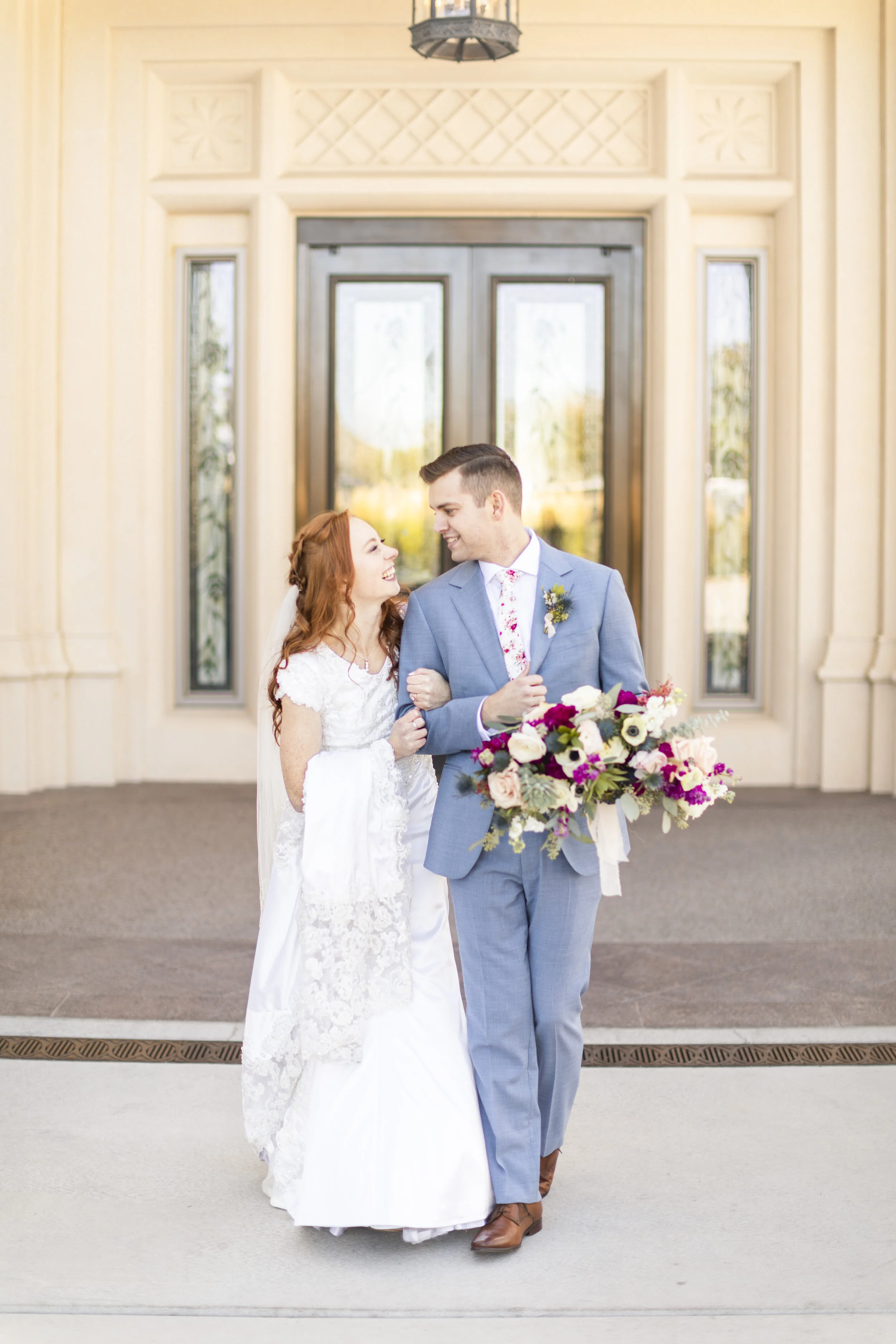  holding wedding dress train pose inspiration walking out of the temple newly weds husband and wife sealed for time and all eternity lds temple wedding summer temple wedding wedding day fun that perfect moment hands are full of love happily wedded ha