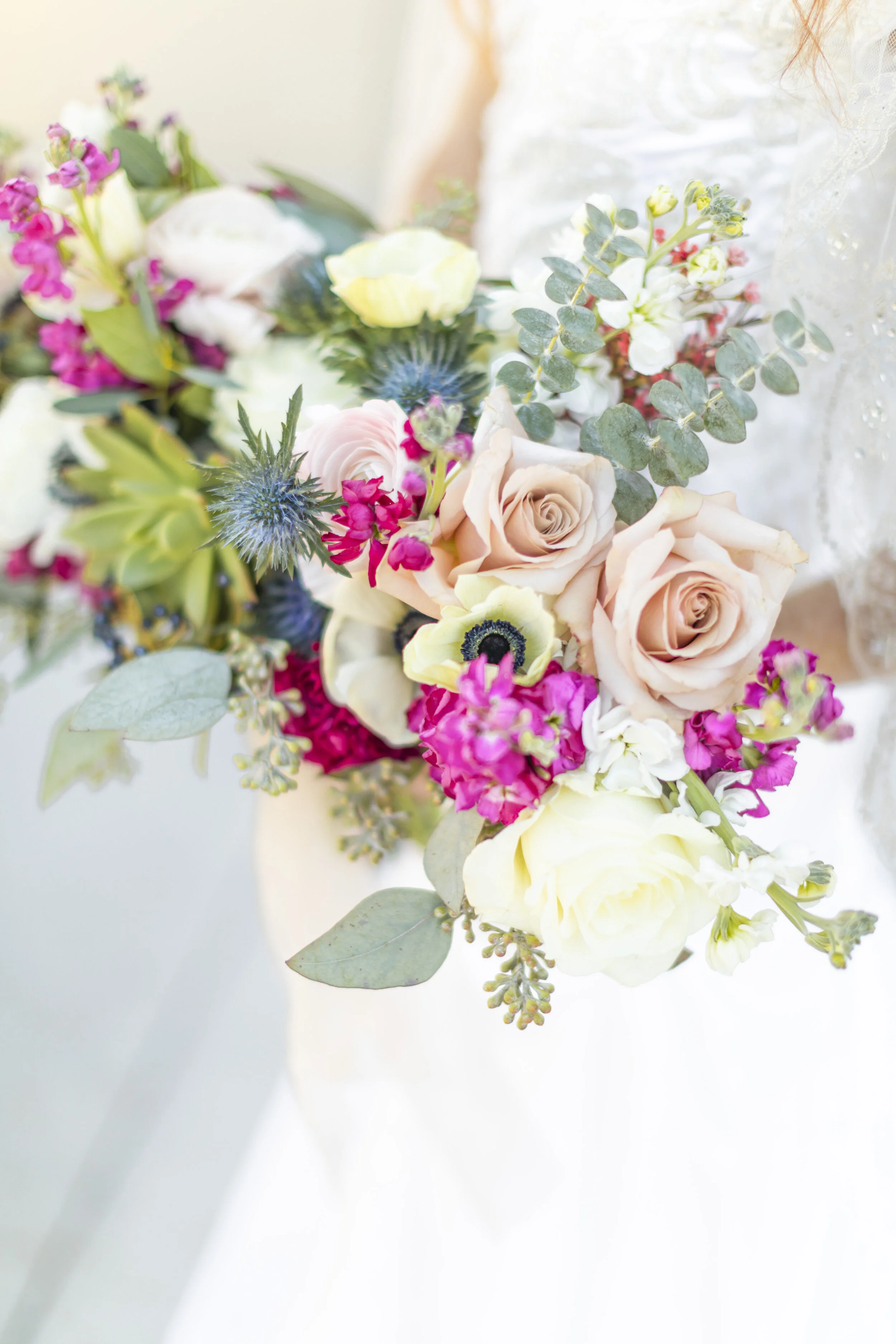  beautiful unique wedding bouquet beautiful bright colors soft pink roses unique greenery bright blue flowers hot pink touches bright green flowers beautifully unique bouquet shape and style wedding bouquet inspiration photographing the bouquet and w