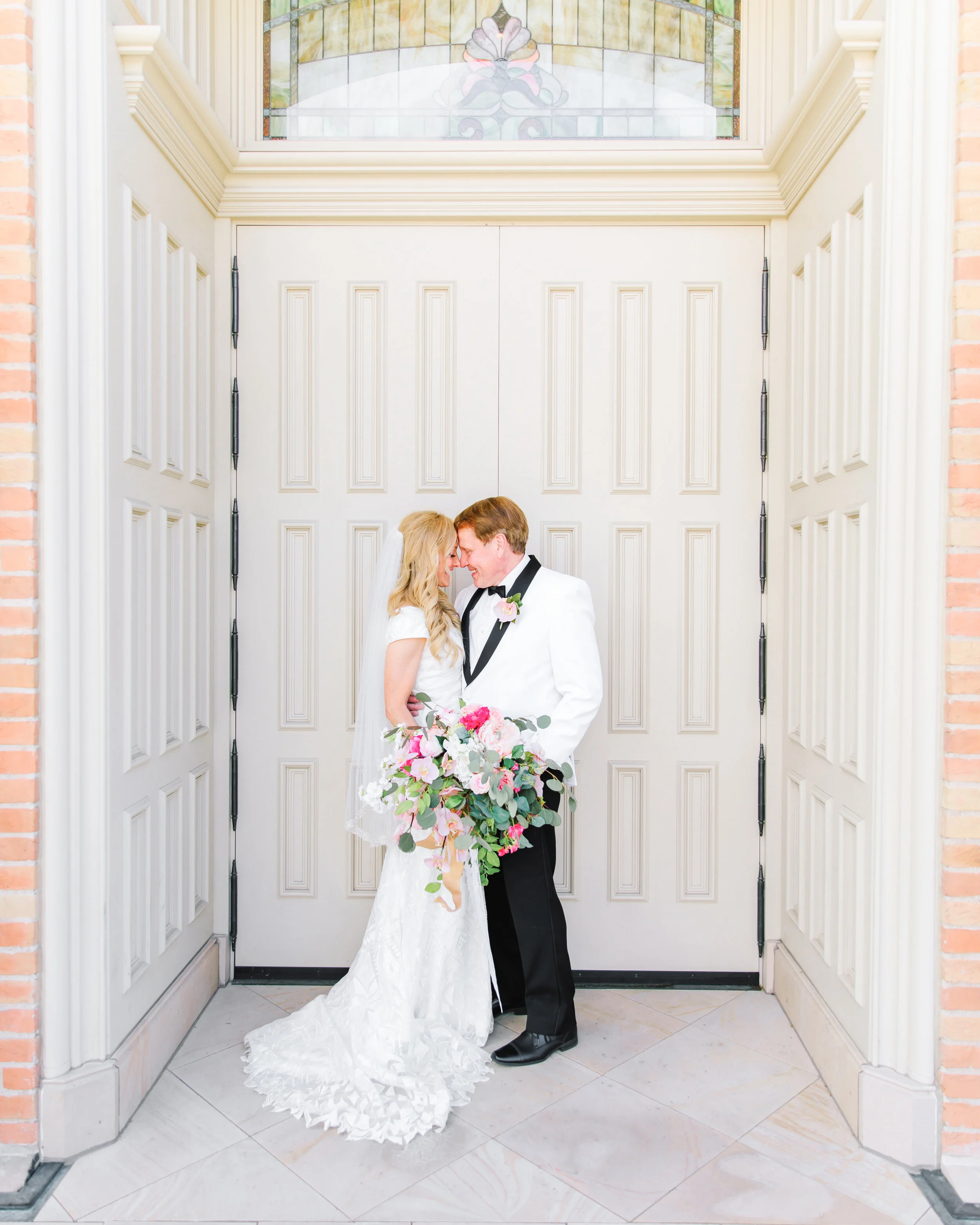  picture by the temple doors traditional lds wedding photo shoot white wedding suit jacket wedding suit jacket unique fun groom attire inspiration wedding bouquet inspiration unique groom attire inspiration moron wedding inspiration bouquet inspirati