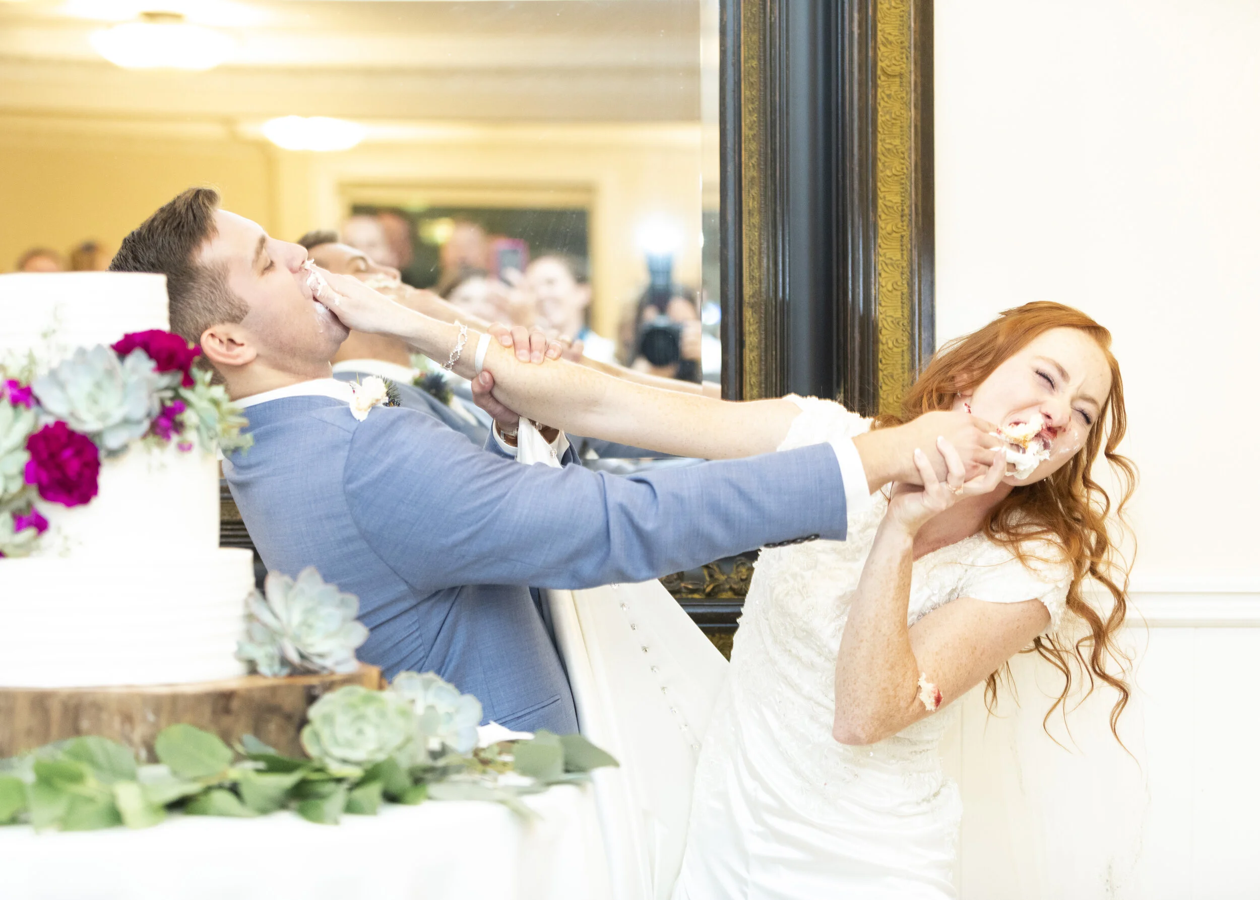  shoving the wedding cake in each others faces wedding day fun pose inspiration wedding cake smash pose inspiration wedding day activities  cake stand table decoration inspiration hilarious couple happy couple couple goals summer wedding attire inspi