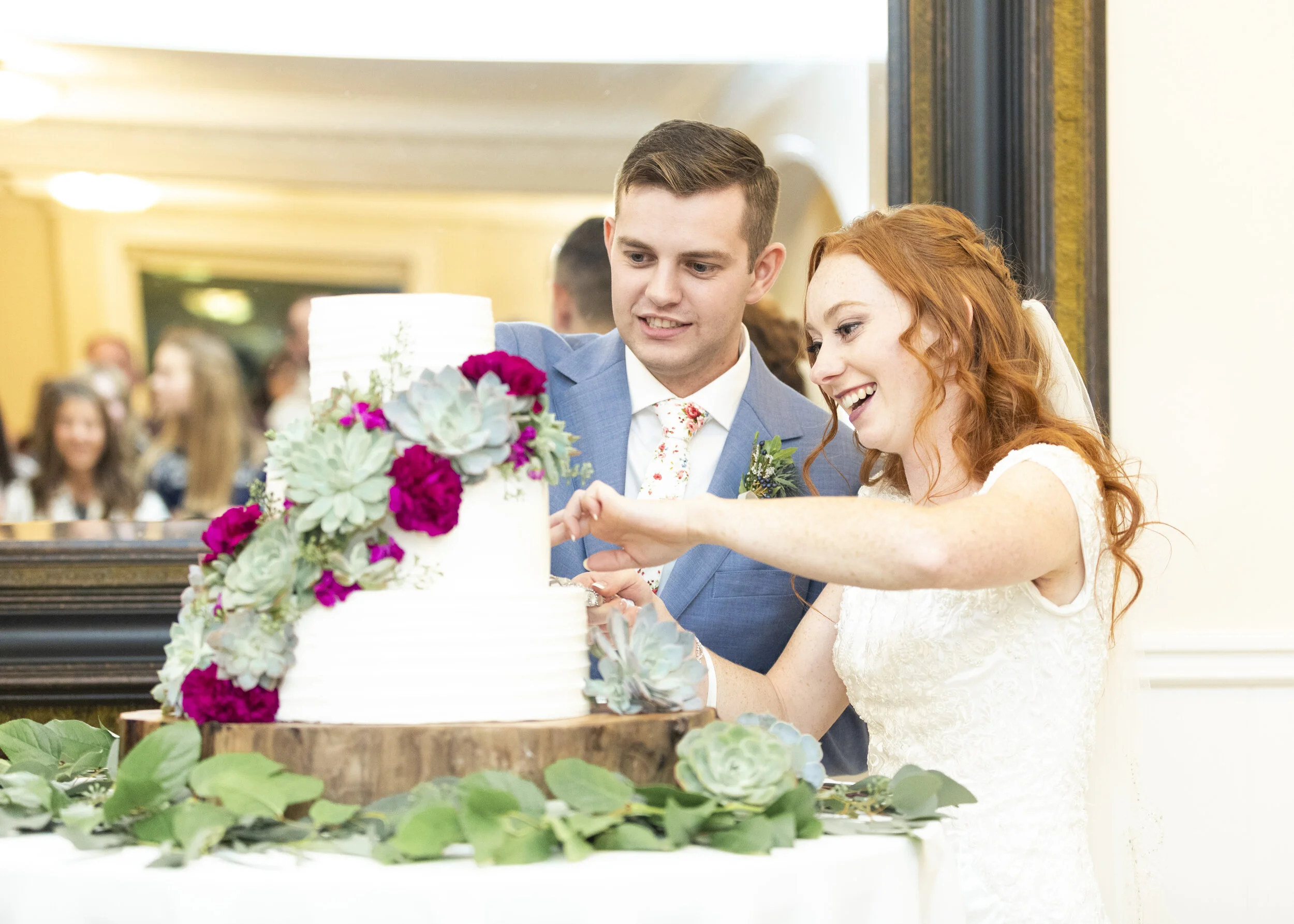  cutting the wedding cake pose inspiration wedding cake stand inspiration natural and earthy cake stand inspiration wedding cake decoration inspiration hot pink and green wedding cake decoration inspiration radiant couple cutting the cake modest wedd