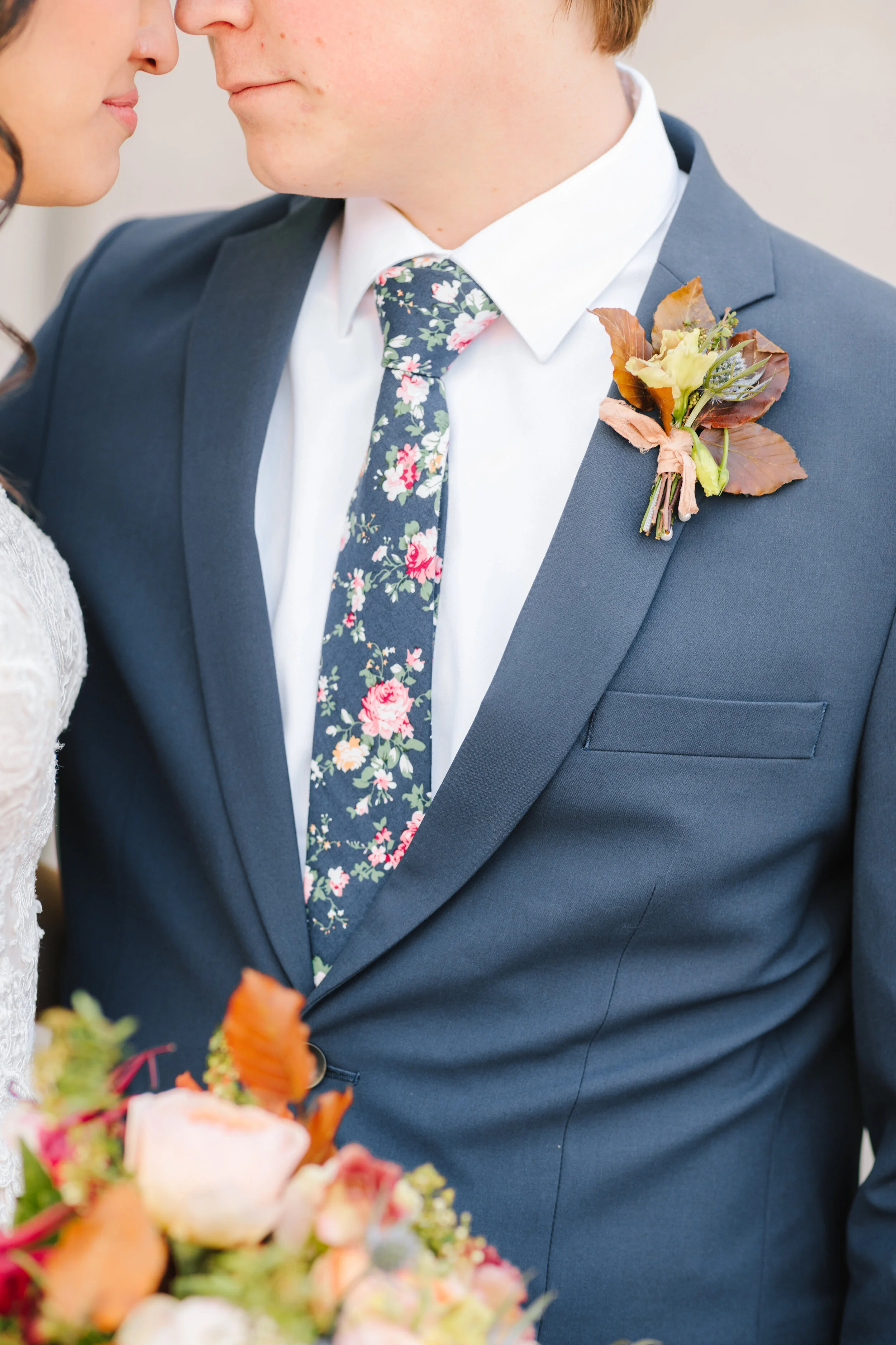  boutonniere inspiration unique fall leaf boutonniere inspiration fall wedding boutonniere goals inspiration and ideas close up on the grooms attire navy blue suit and tie floral tie professional close up wedding photography inspiration and goals war