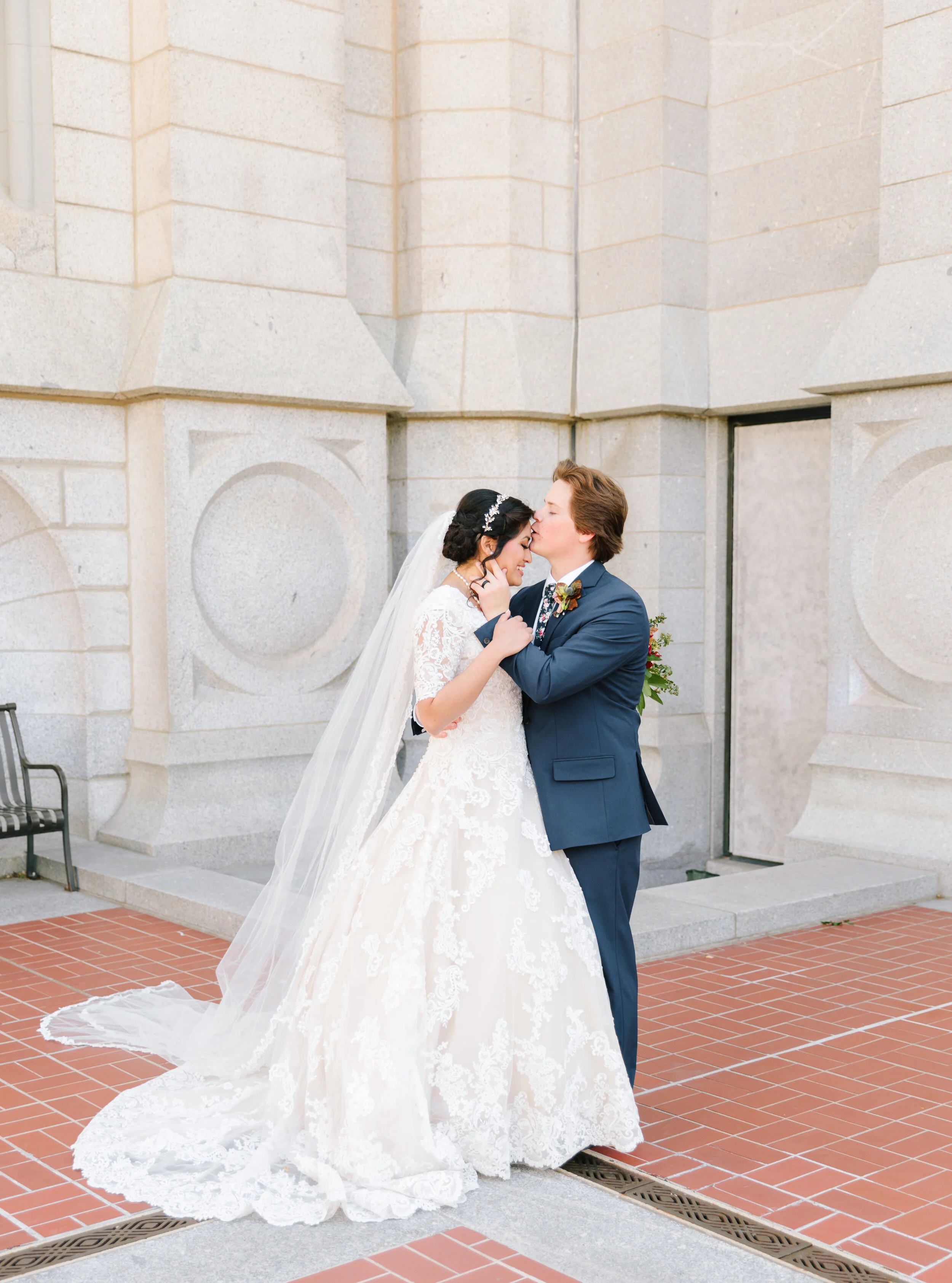  forehead kiss on salt lake city temple grounds lace princess wedding dress inspiration beautiful gown salt lake city temple architecture sweet moment long wedding veil goals couple goals marriage goals wedding goals wedding inspiration for utah brid