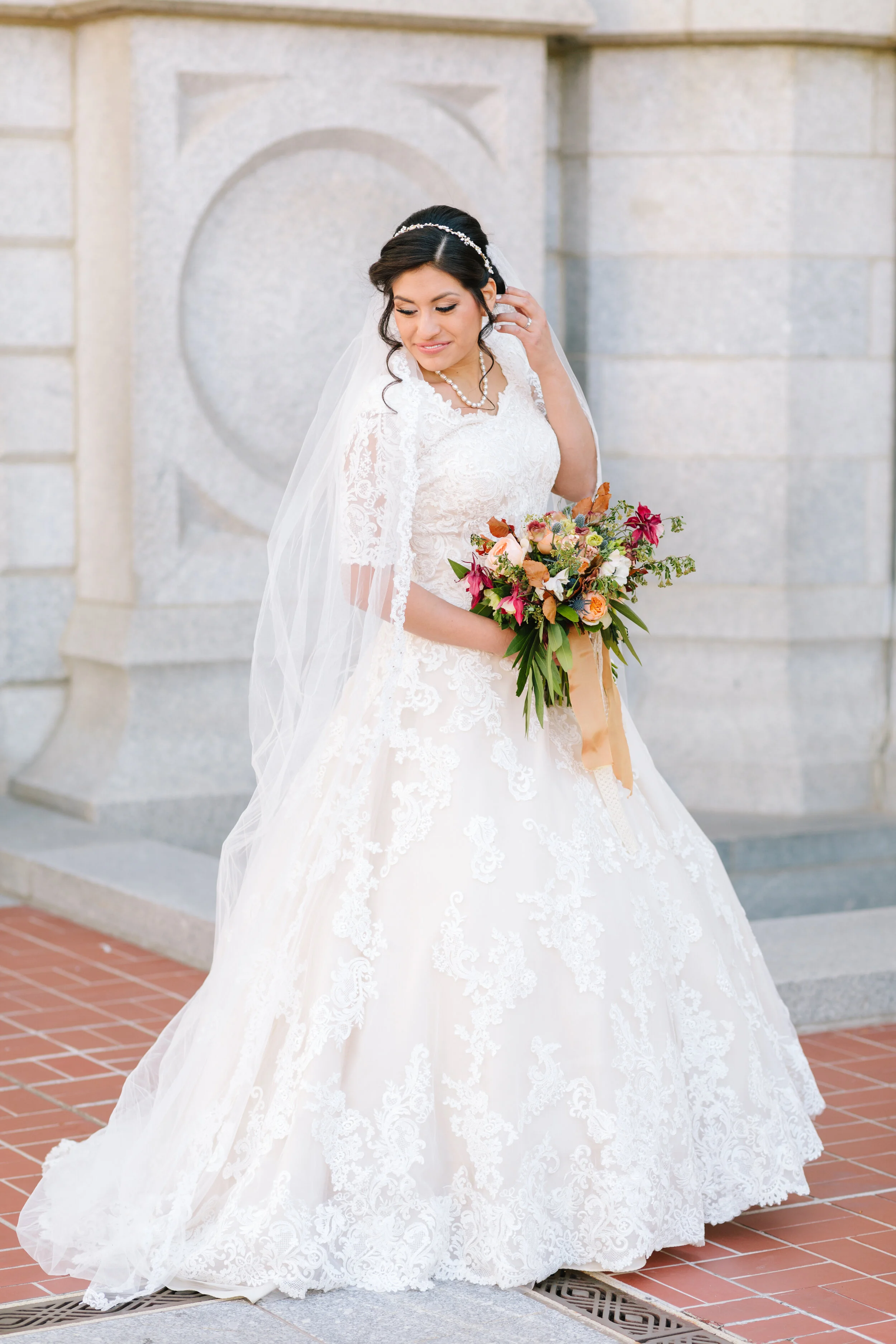  gorgeous bride just the bride bridal pose inspiration natural bridal pose natural pose inspiration holding the bouquet and moving back her hair bridal hairstyle inspiration bridal up do inspiration wedding aesthetic inspiration ideas and goals beaut