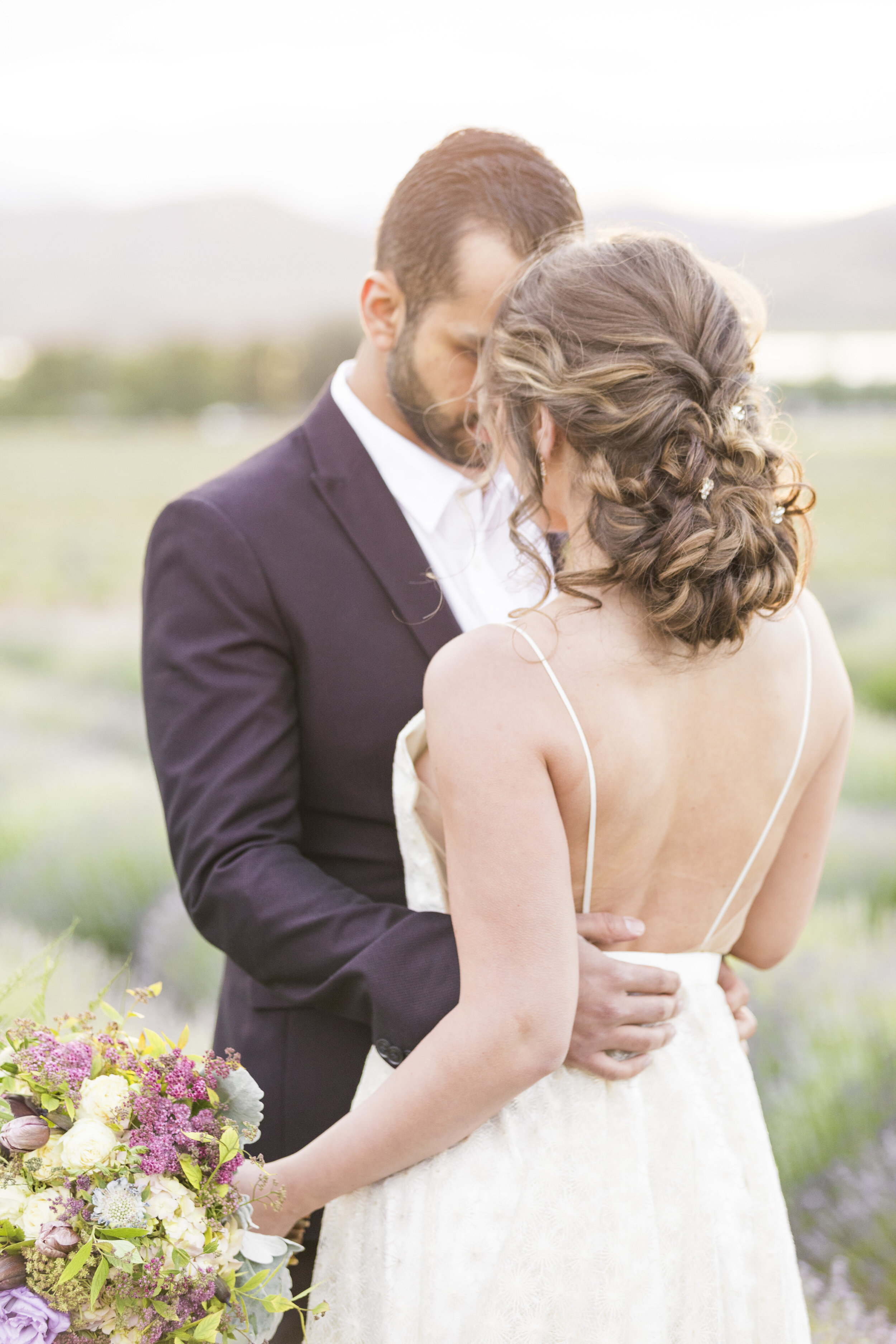  intricate romantic beautiful wedding hairstyle inspiration spaghetti strap wedding dress inspiration low back wedding dress inspiration outdoor lavender wedding style photo shoot session in utah utah lavender field wedding photo shoot inspiration #w