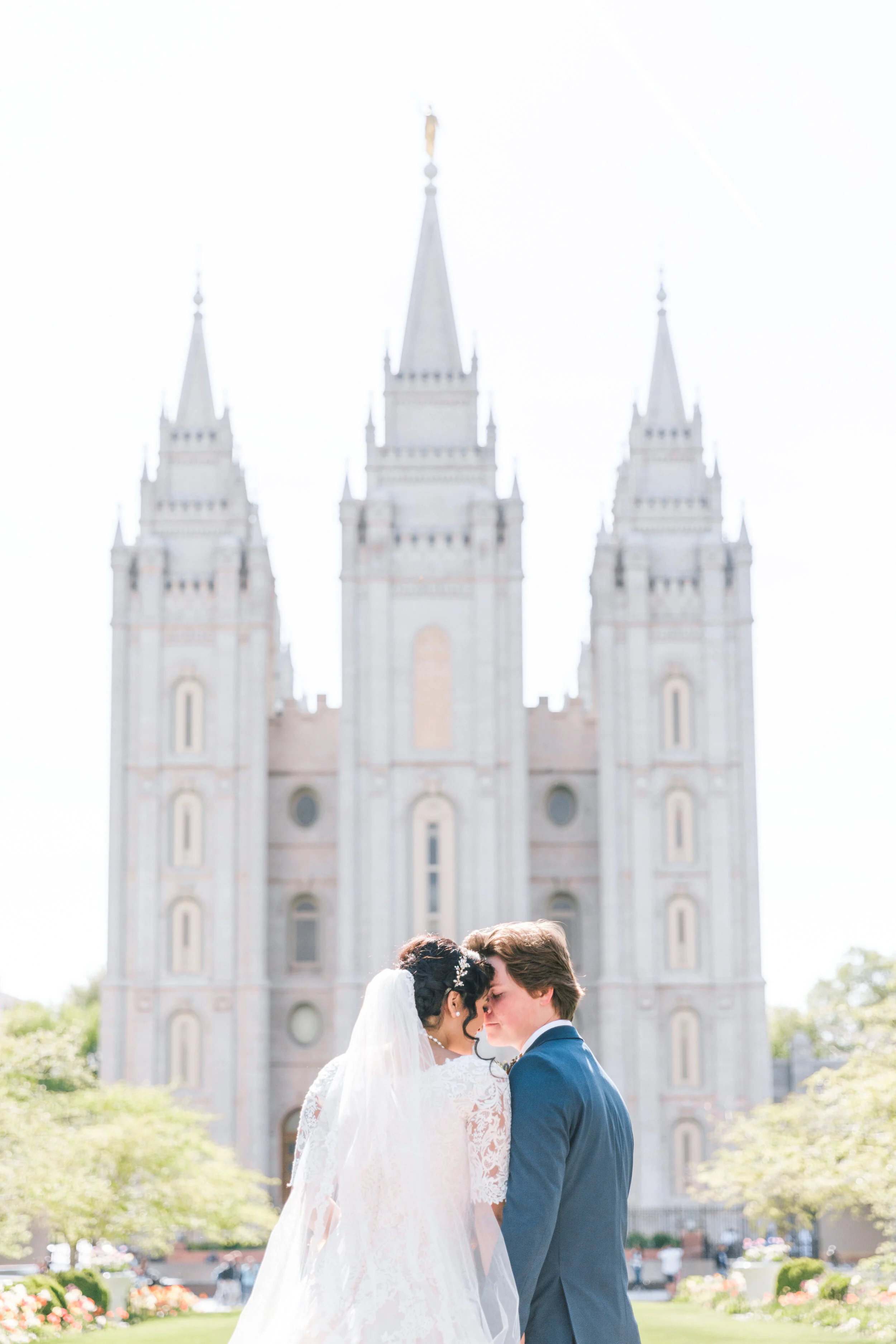  unique kiss in front of the salt lake city temple beautiful moment between husband and wife im going there someday sealed  for time and all eternity wedding day photo shoot goals wedding inspiration mormon wedding day goals mormon wedding lds temple