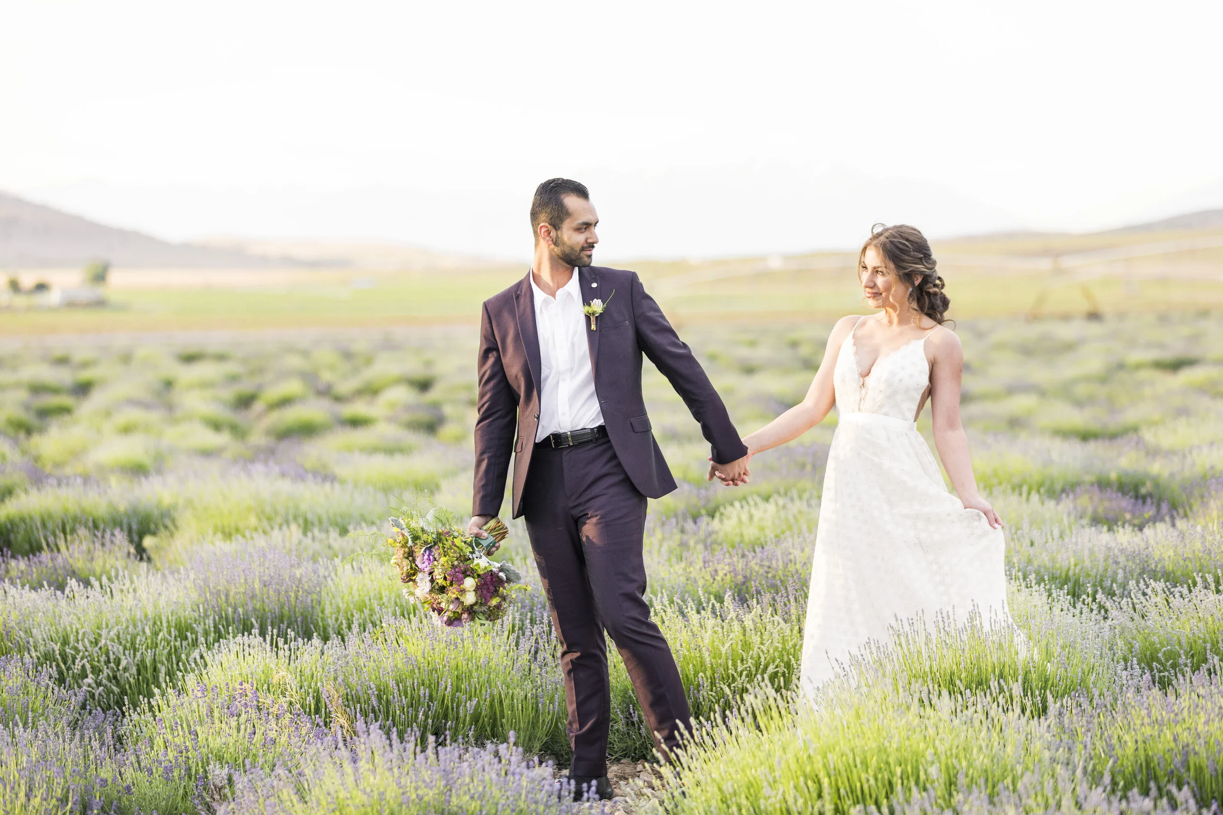  romantic walk through the lavender field husband guiding wife through the lavender field romantic wedding dress inspiration deep sweet heart neckline wedding dress goals wedding photo shoot inspiration wedding location inspiration couple goals #wedd