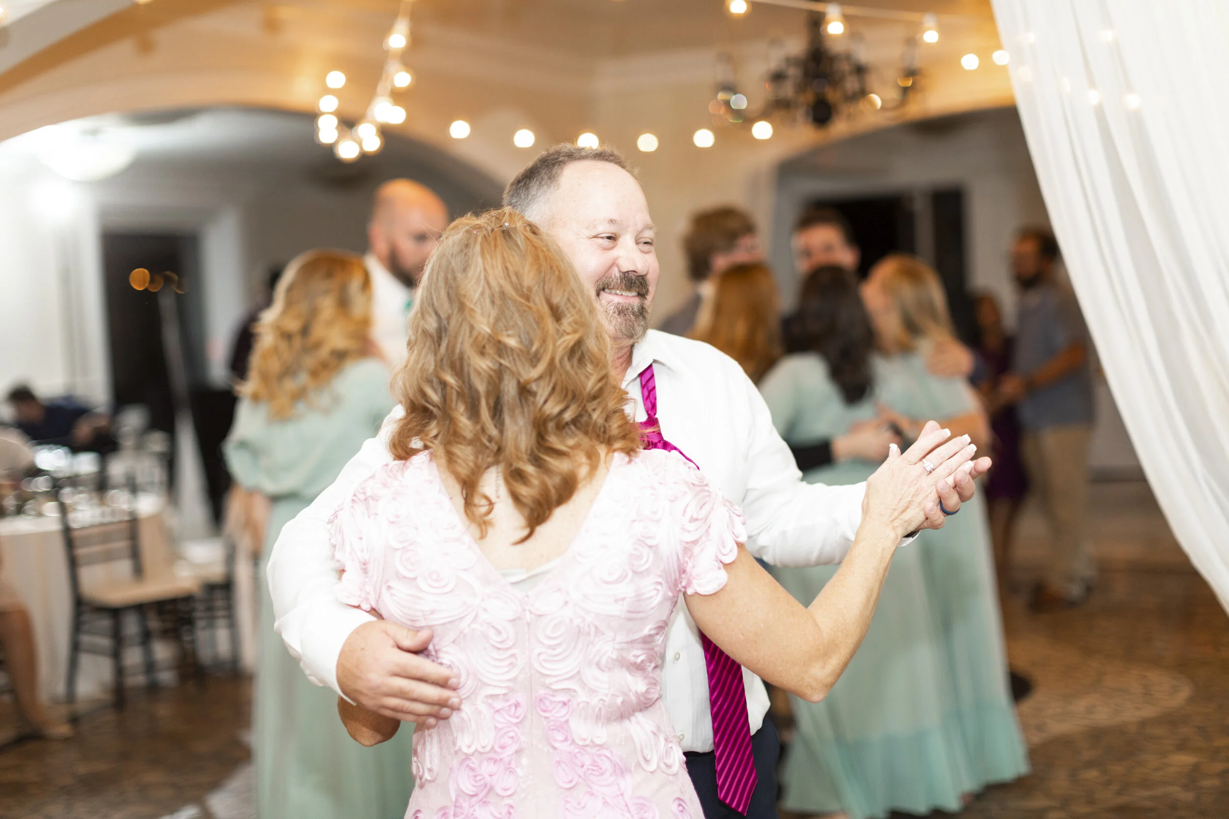  mother and father of the bride pose dancing reception fun mother and father of the bride attire inspiration lds wedding inspiration wedding reception fun wedding reception photography profession wedding photography wedding reception professional pho
