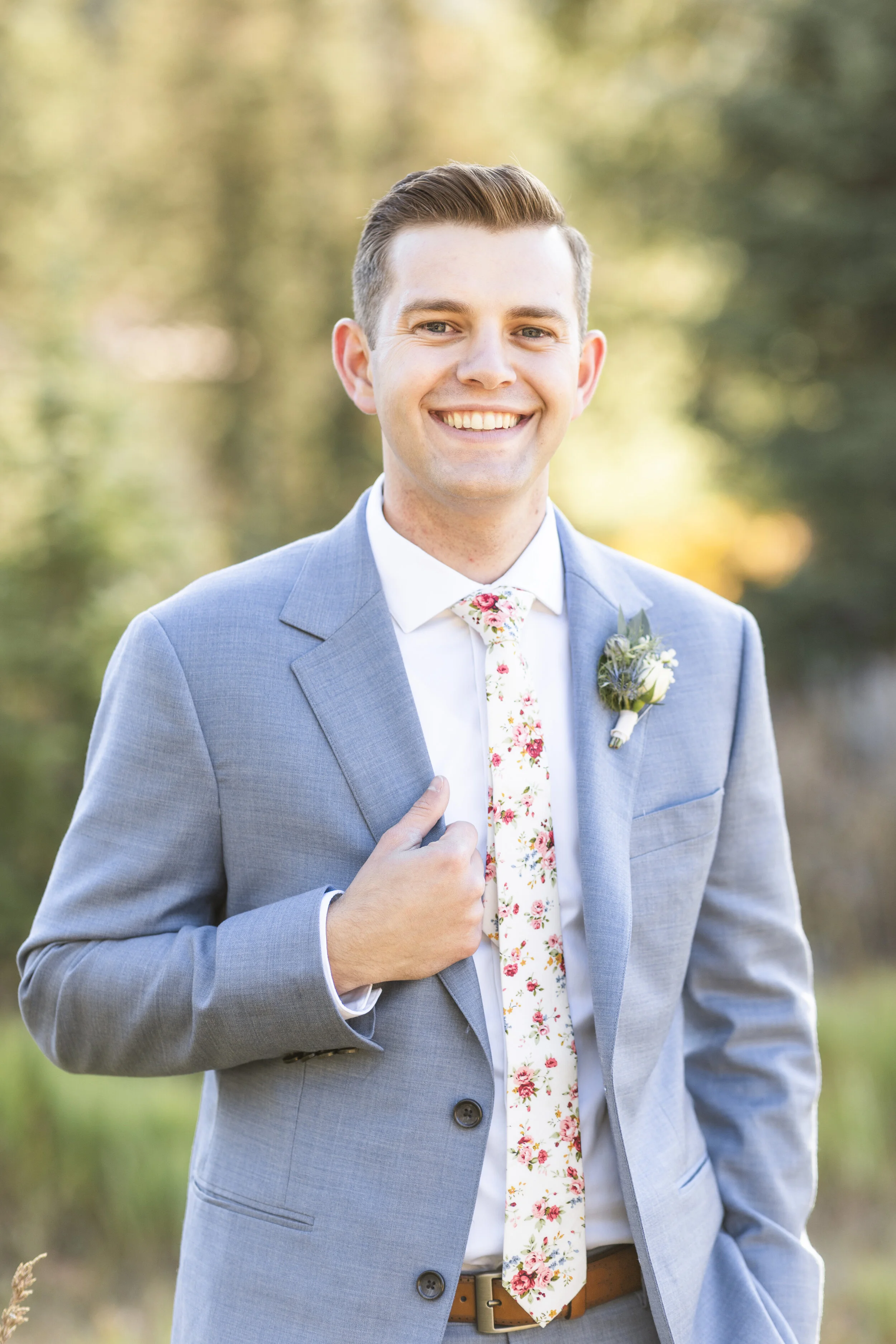  Happy groom on his wedding day groom pose hand placement inspiration classy groom pose groom hairstyle inspiration mens haircut floral tie wedding day new husband instagram worthy groom portrait professional wedding photographer salt lake city canyo