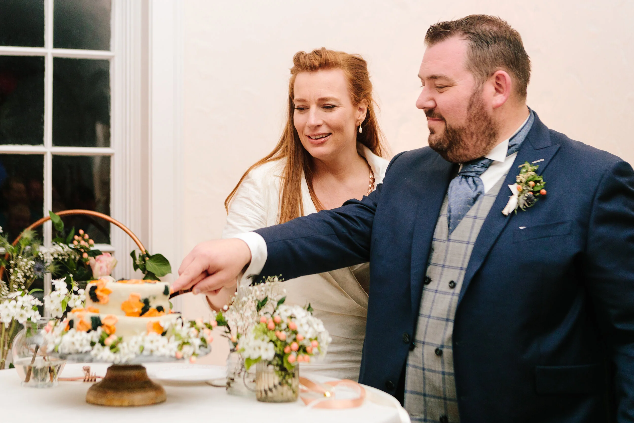  cutting the cake at the wedding reception bride groom and bridal party group photo outside temple wedding dress lds weddings salt lake city utah sealing wedding #lds #ldswedding #wedding #utah #utahwedding #weddingphotographer #weddingphotography #c