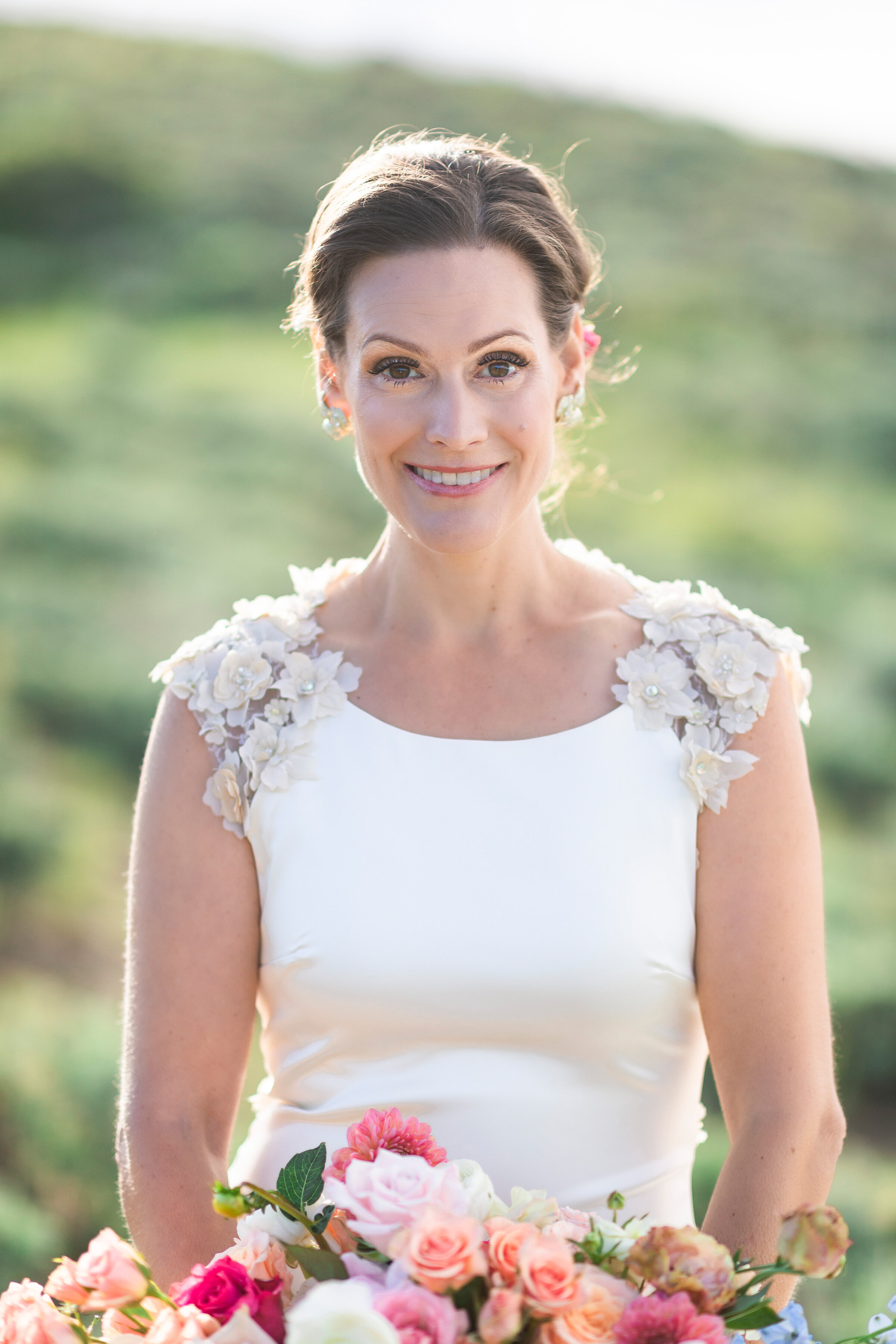  wedding bridals located in the  lush green utah mountains, featuring a blurred background and floral accented bridal dress by clarity lane photography. diamond wedding earrings bridal portraits focused bridal photography green utah mountains best pr