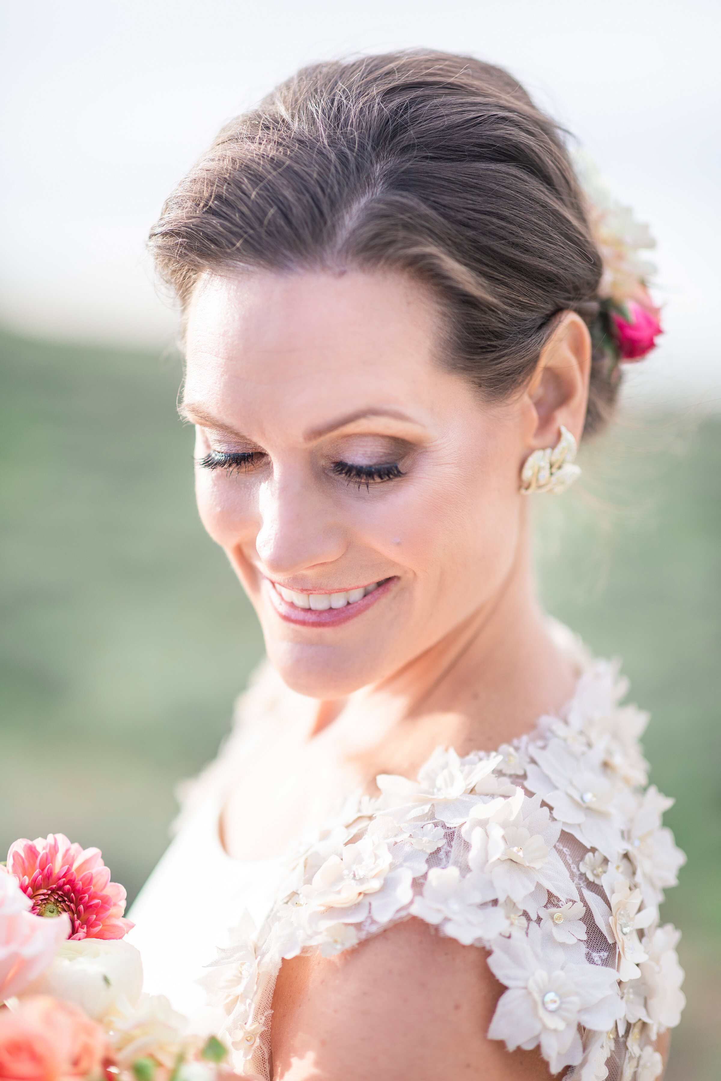  focused bridal photography by clarity lane photography featuring feminine bridal accessories and utah mountains, in salt lake city. floral accented wedding dress sleeves laced wedding sleeves and back floral bridal updo petal pink bridal wedding bou