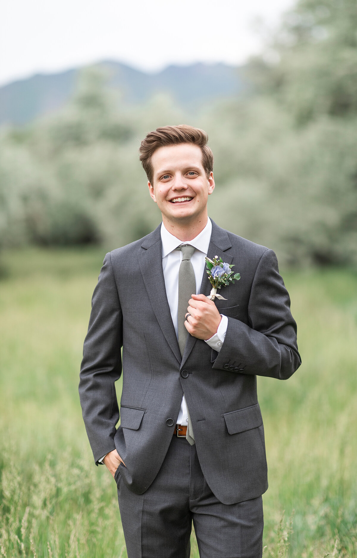 charcoal suit with champagne tie
