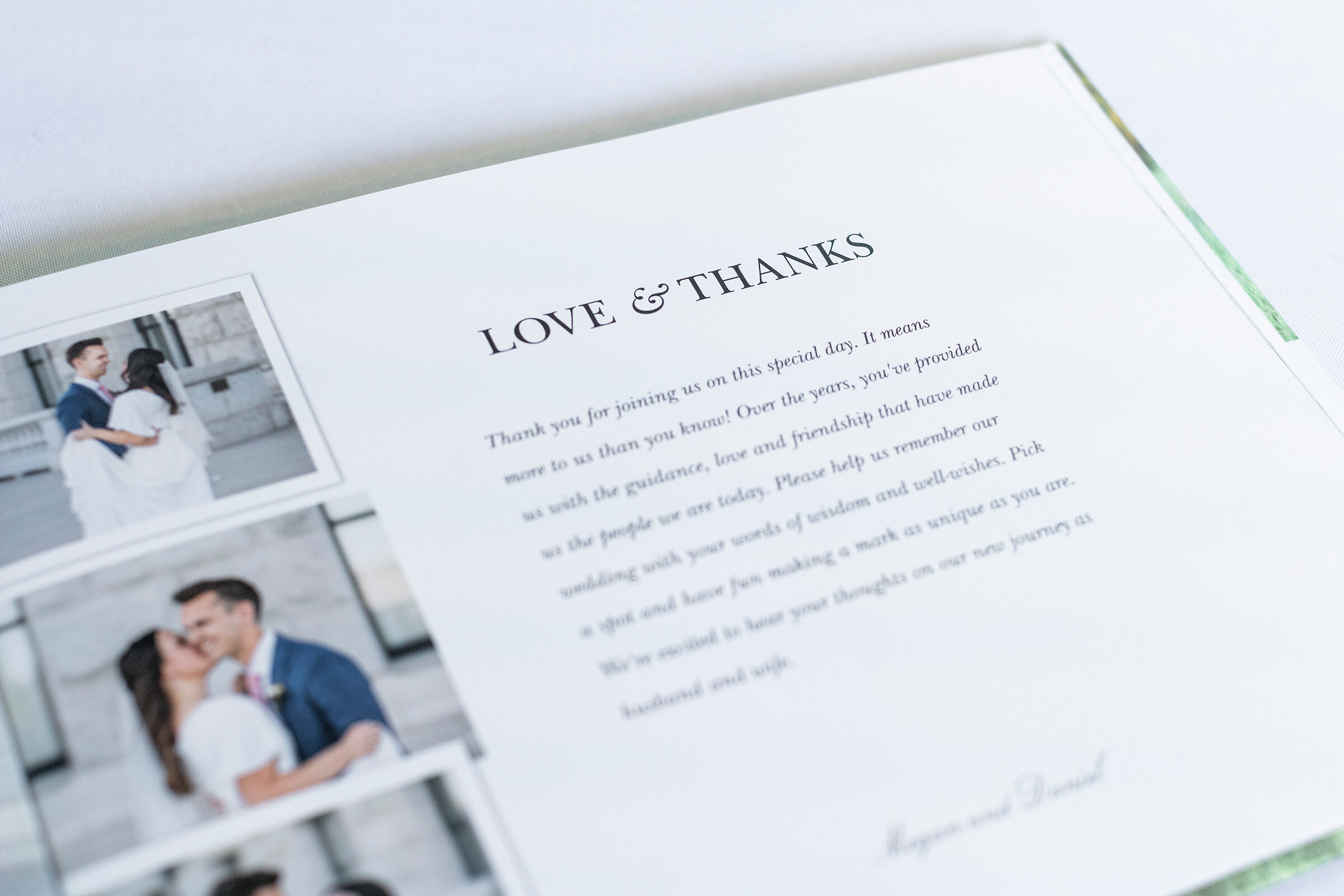  Close up image of a wedding guestbook open to welcome page with photographs of the couple, photographed by Clarity Lane Photography in Salt Lake City, Utah. traditional wedding decor classic wedding guestbooks elegant Salt Lake City weddings Norther