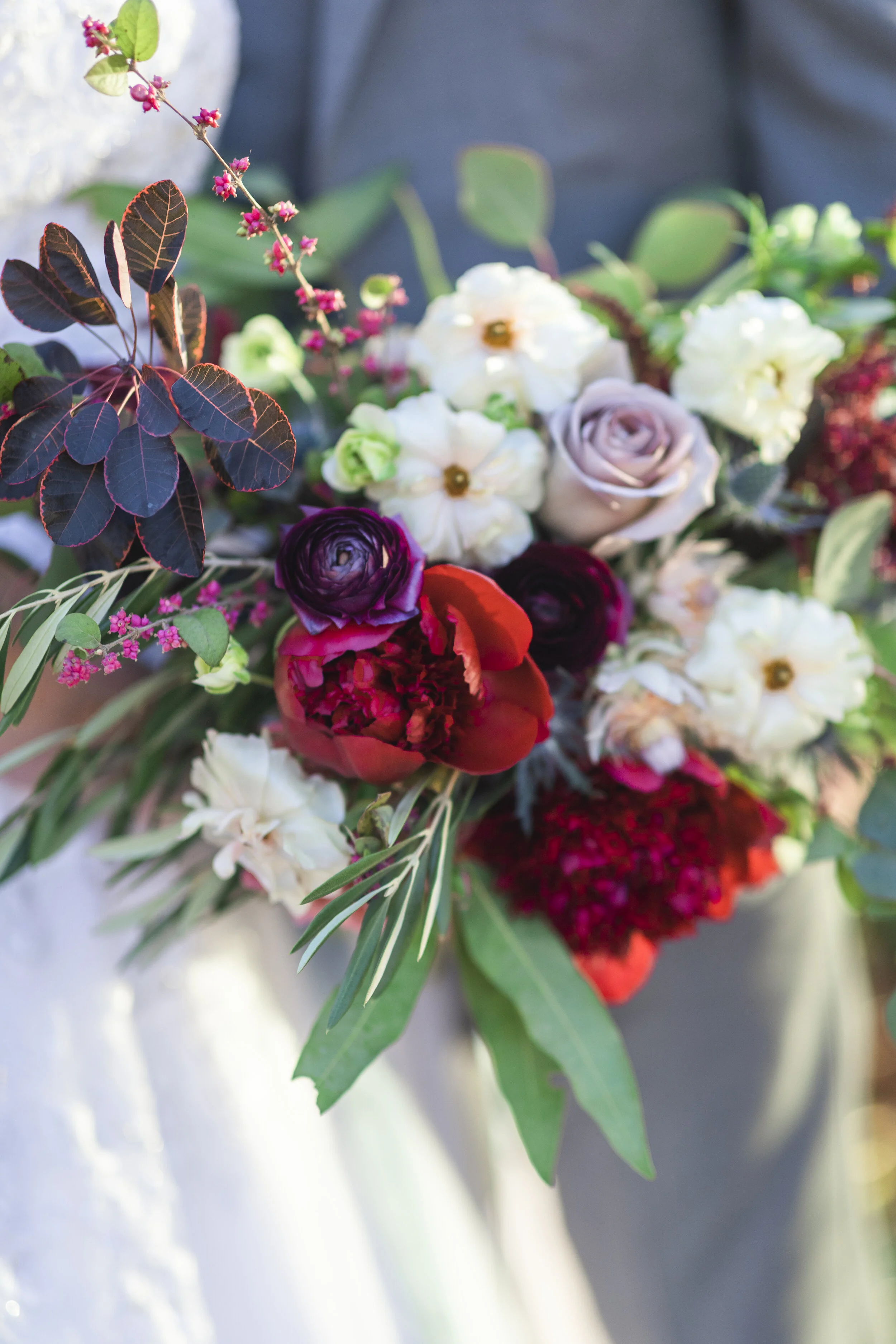  Colorful bridal bouquet with red and purple and pink flowers for a winter styled wedding shoot in Salt Lake City, Utah by Clarity Lane Photography. summer wedding timeless wedding photography colorful wedding flowers Northern Utah red purple pink bo