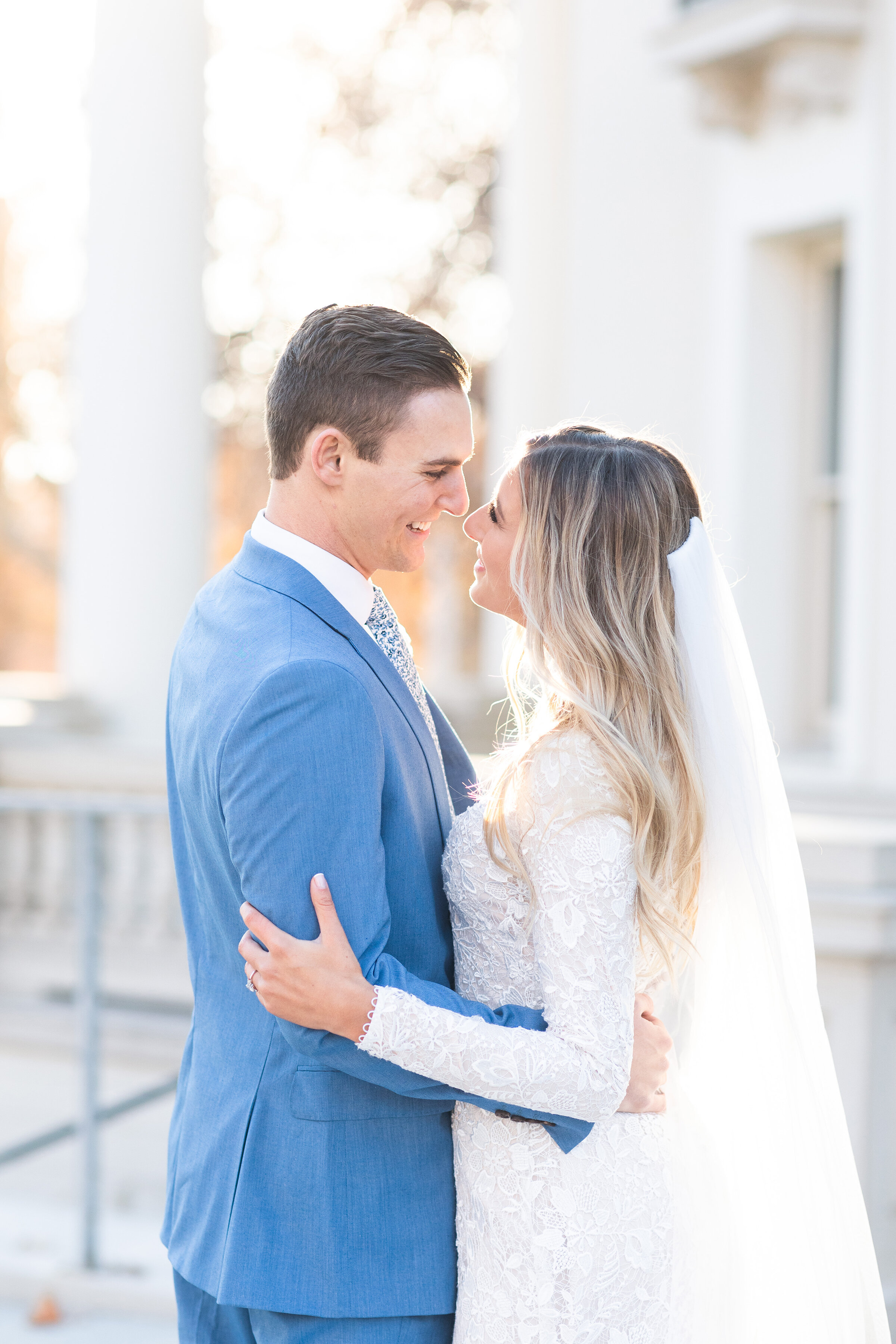  With beautiful stone pillars in the background, Clarity Lane Photography photographs a romantic exchange between this soon to be bride and groom in Salt Lake City, Utah. professional salt lake county wedding photographer, bright and airy photography
