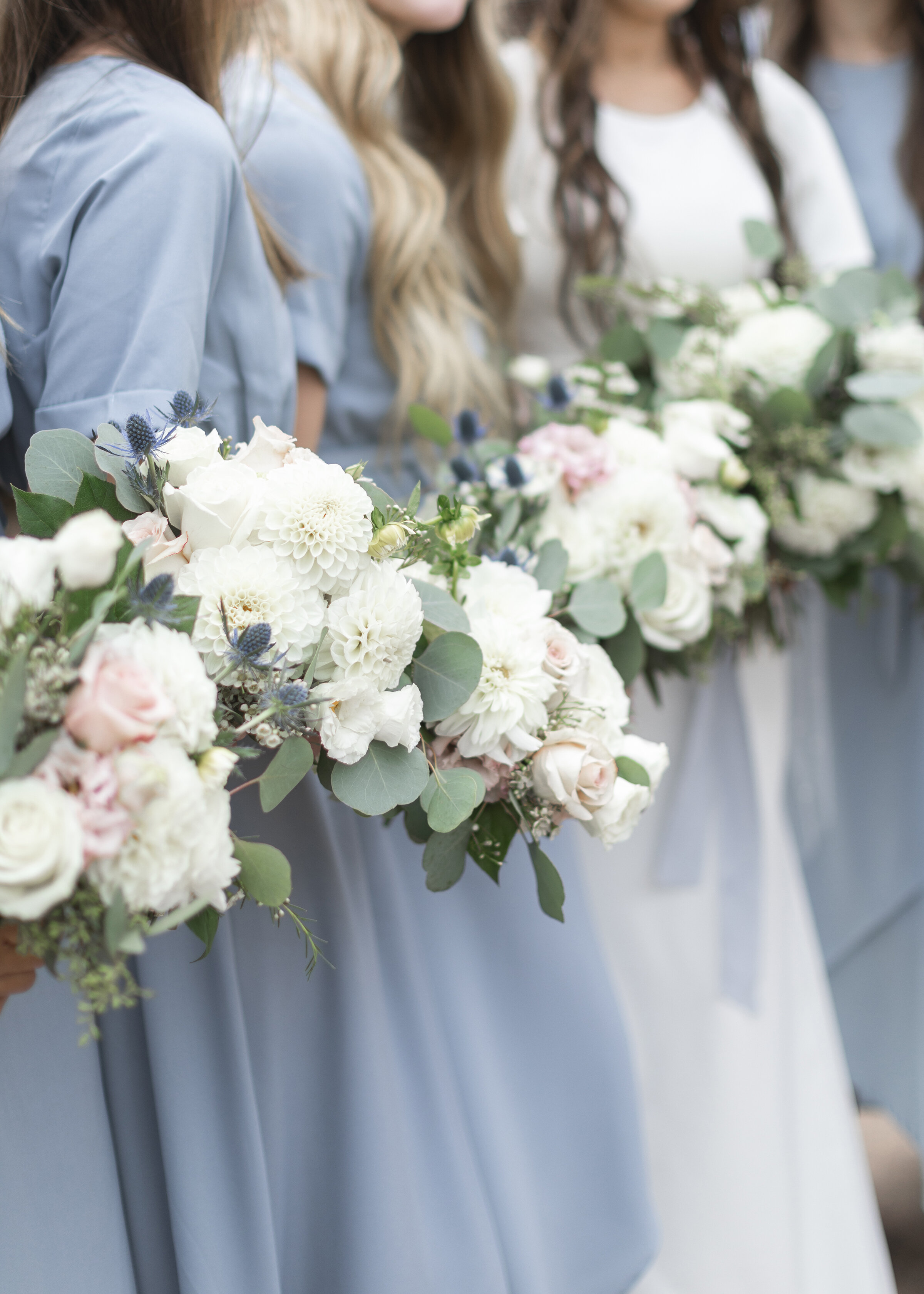  Clarity Lane Photography captures this Utah Valley bride’s wedding day details, featuring her bridesmaids adorned in dusty blue dresses. white and soft pink wedding bouquet, bridesmaids white and pink wedding bouquets, wedding bouquets filled with g