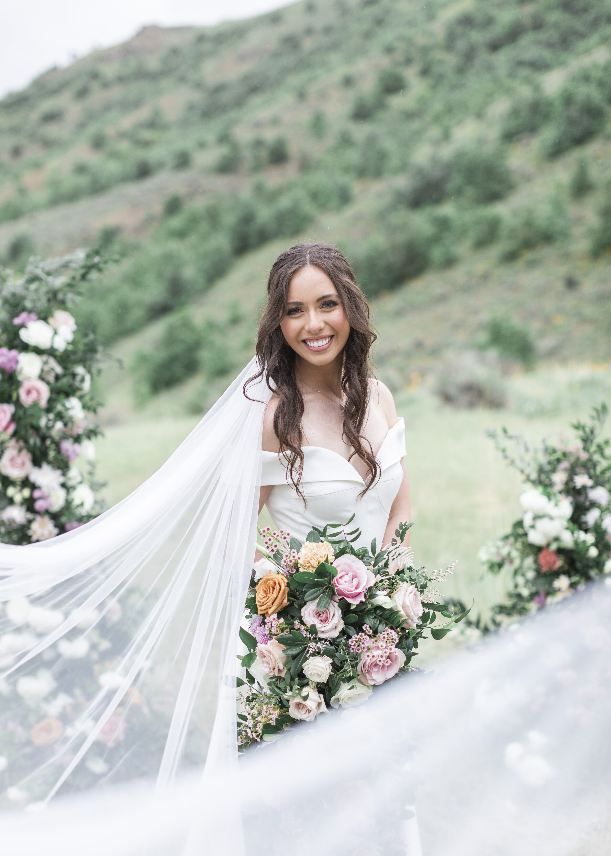  Veil photography by Clarity Lane Photography featuring a bride in the Logan mountains with rose bouquet during a photography workshop. bridal photography northern Utah wedding photographer #claritylanephotography #claritylaneweddings #claritylanewor